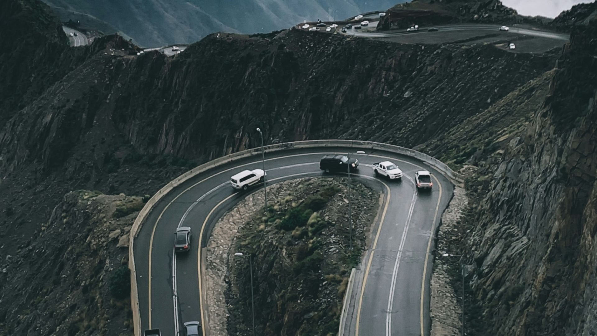 gray asphalt road on mountain during daytime