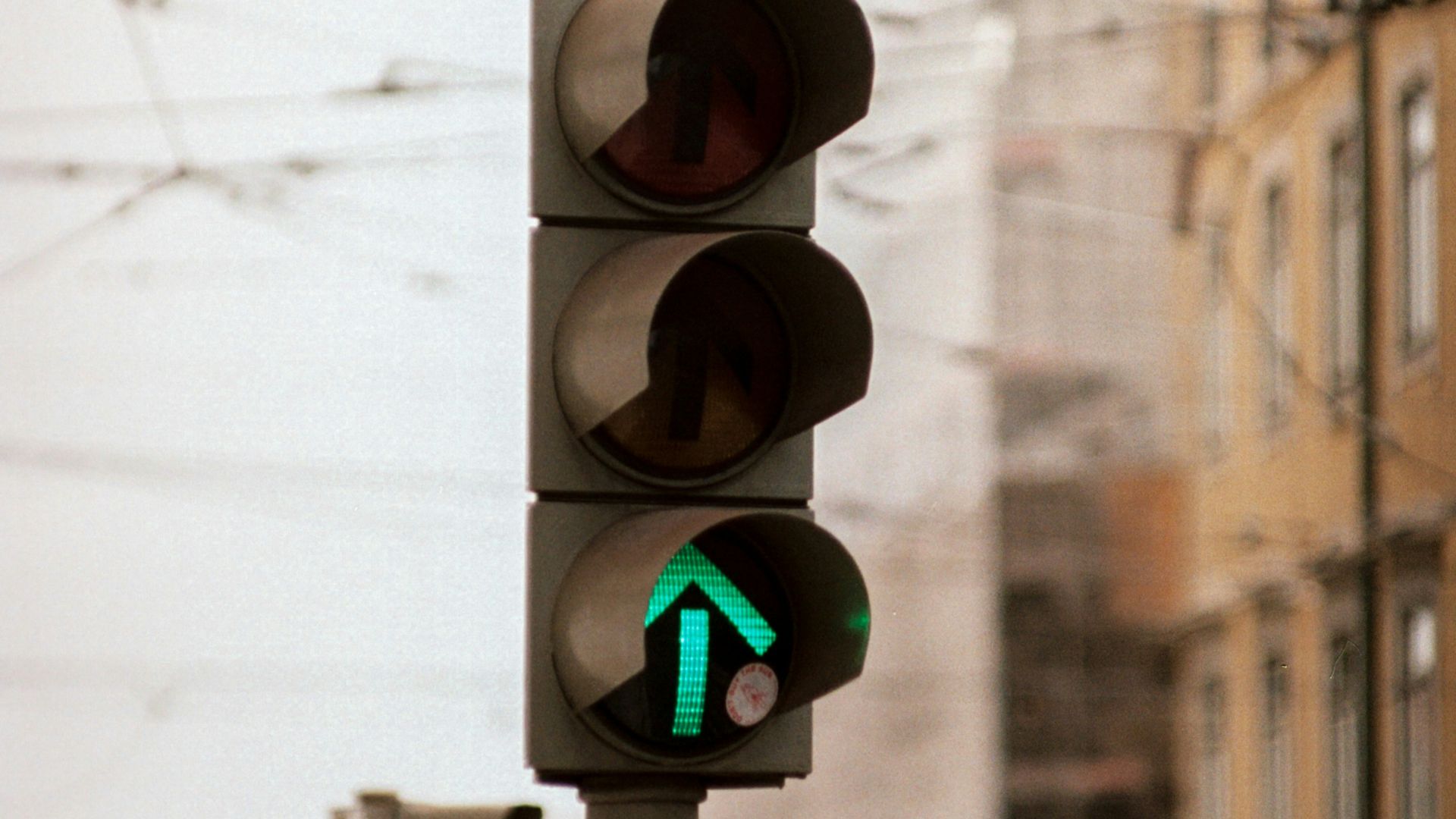 traffic light displaying green up arrow