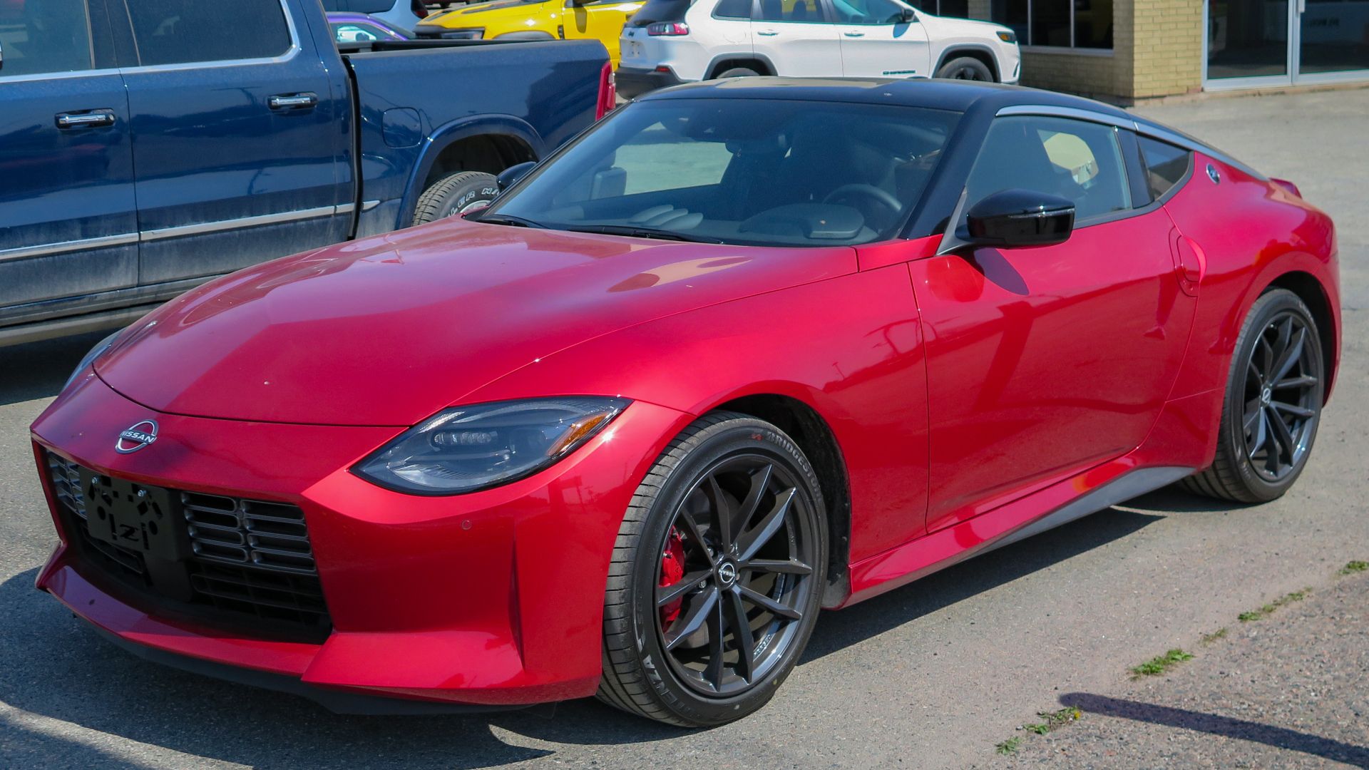 File:2023 Nissan Z Performance 6MT in Passion Red TriCoat, Front Left, 05-17-2023.jpg