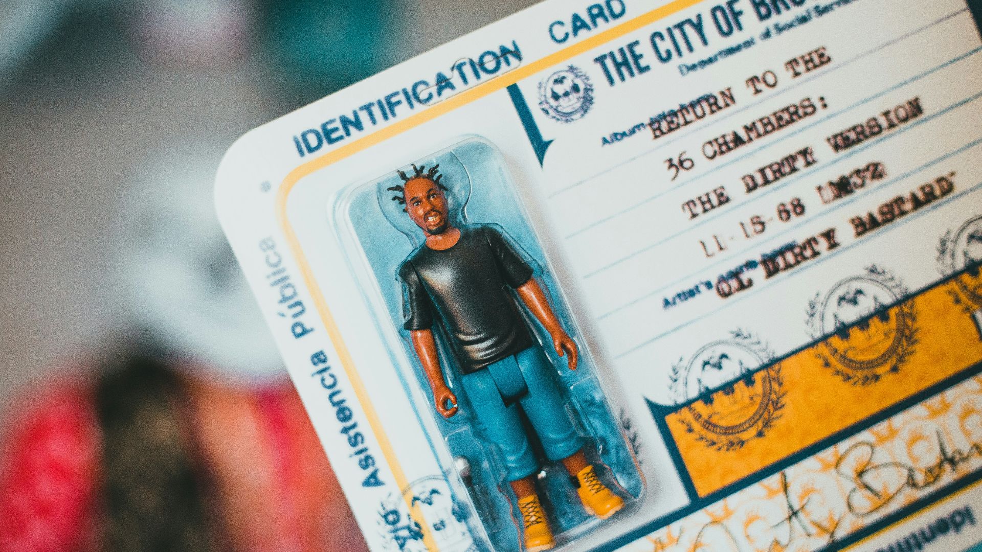 person holding white and blue card