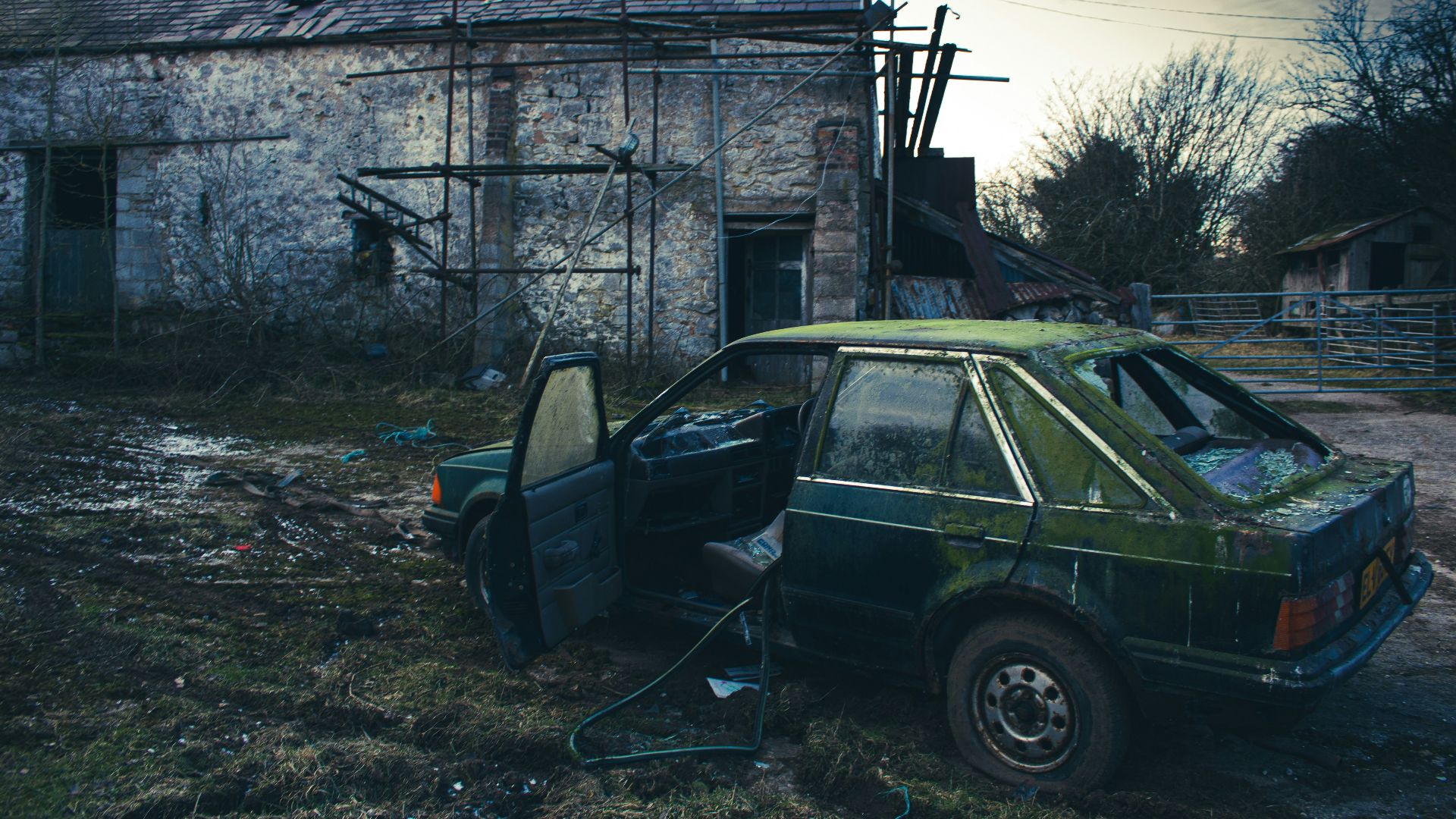 black suv parked beside gray concrete building