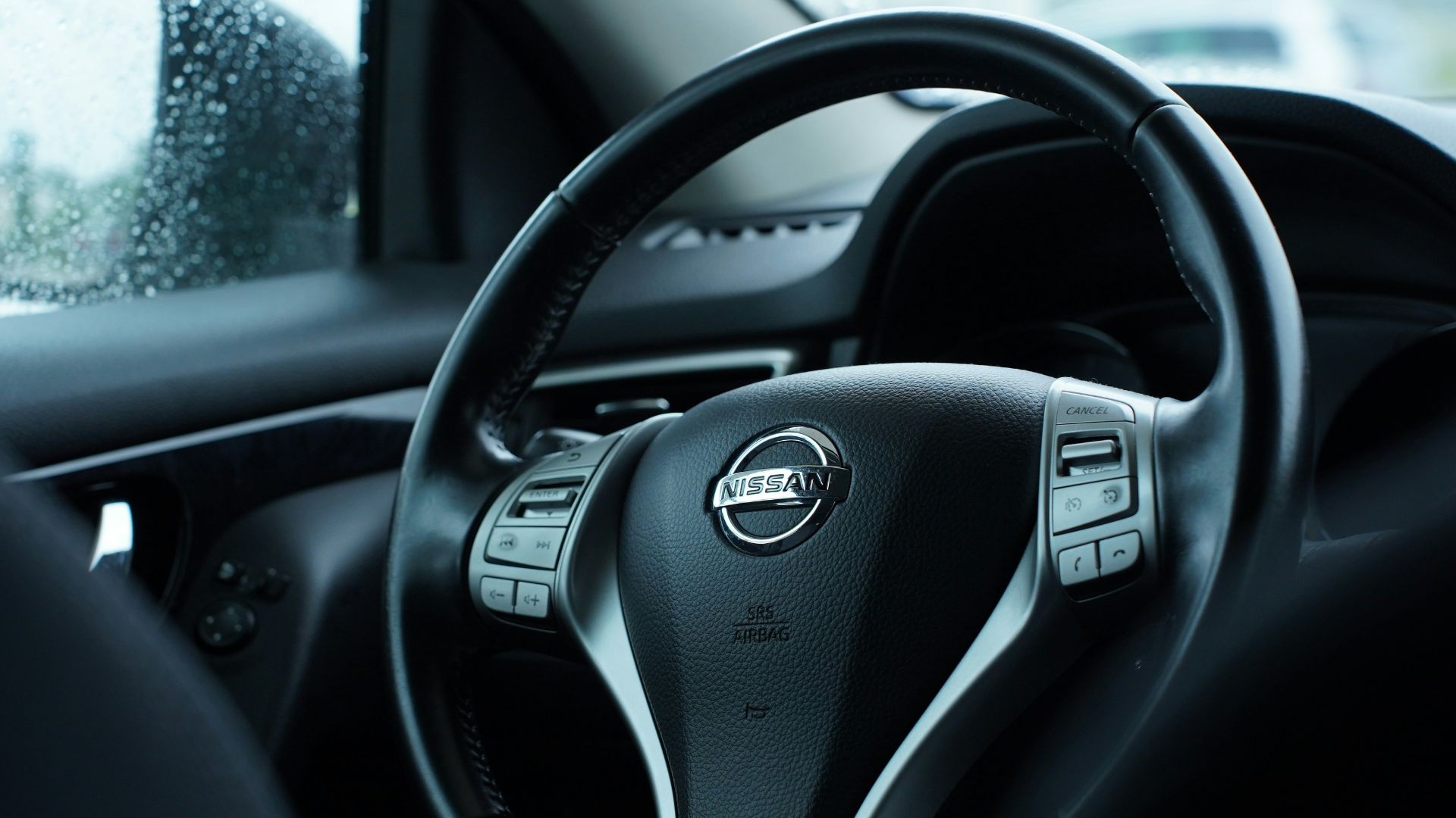 a steering wheel and dashboard of a vehicle