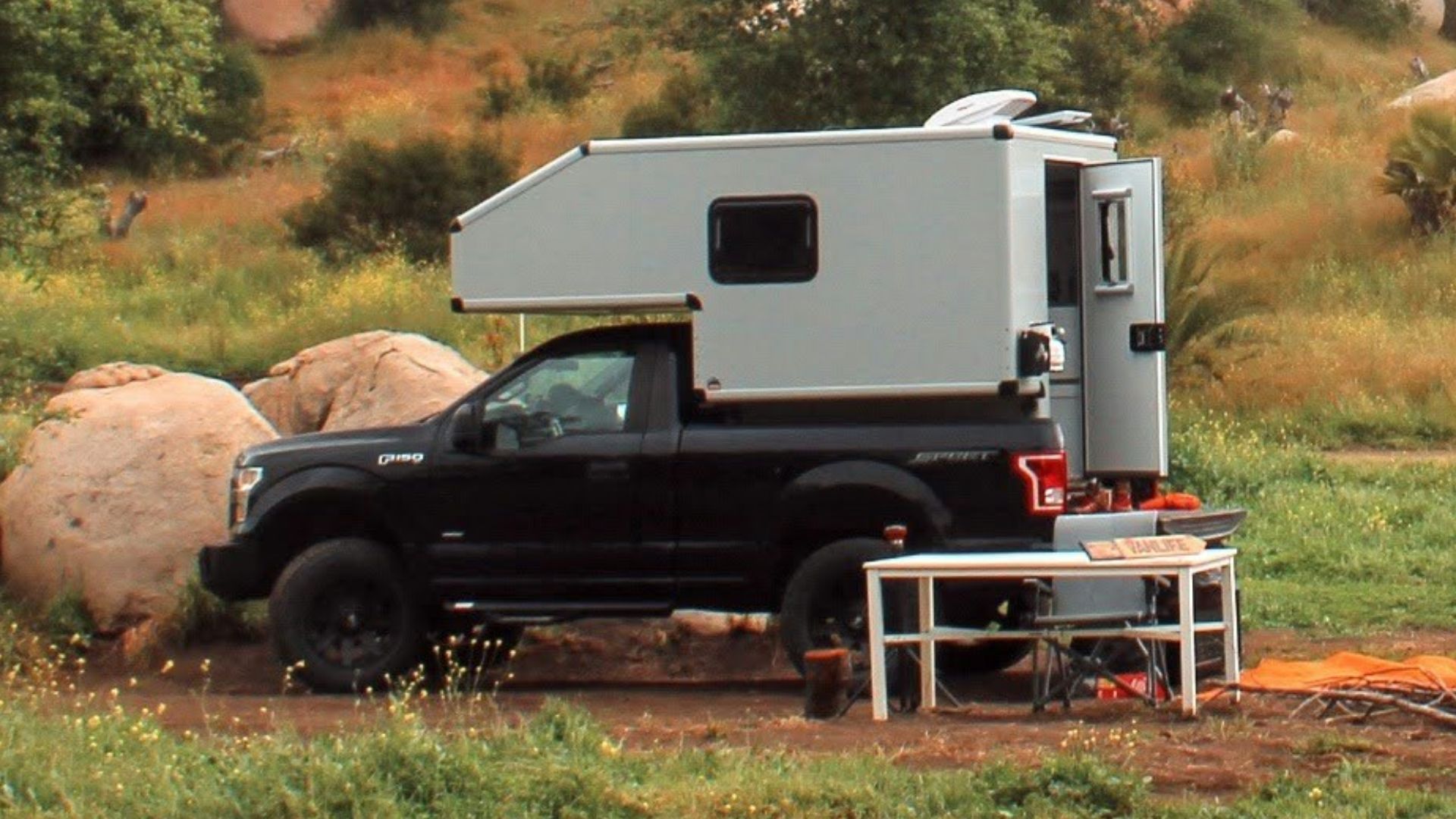 a truck is parked in the middle of a field