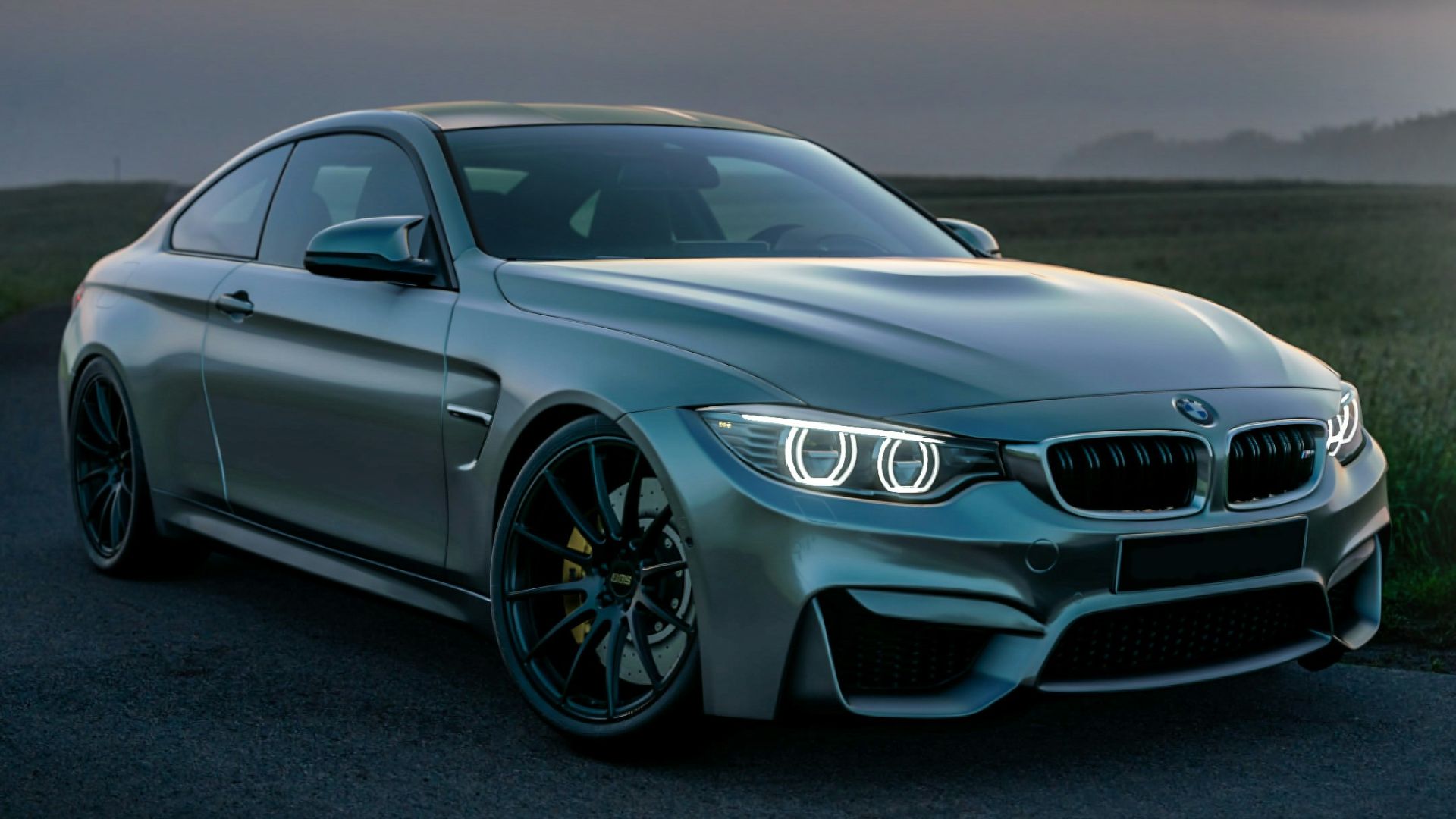 gray mercedes benz coupe on black asphalt road during daytime