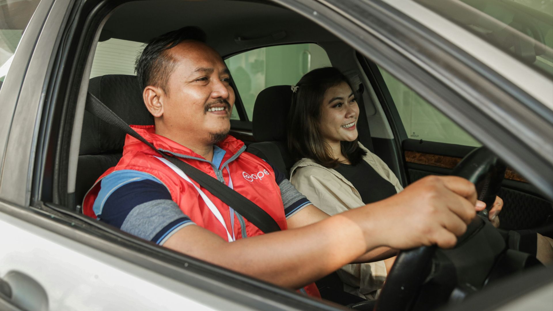 a man and woman in a car
