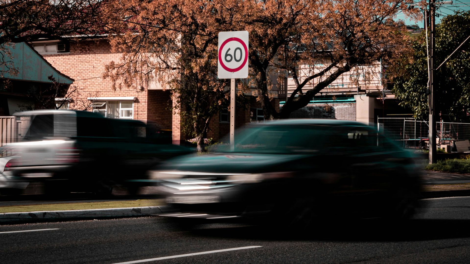 time lapse photo of car on road