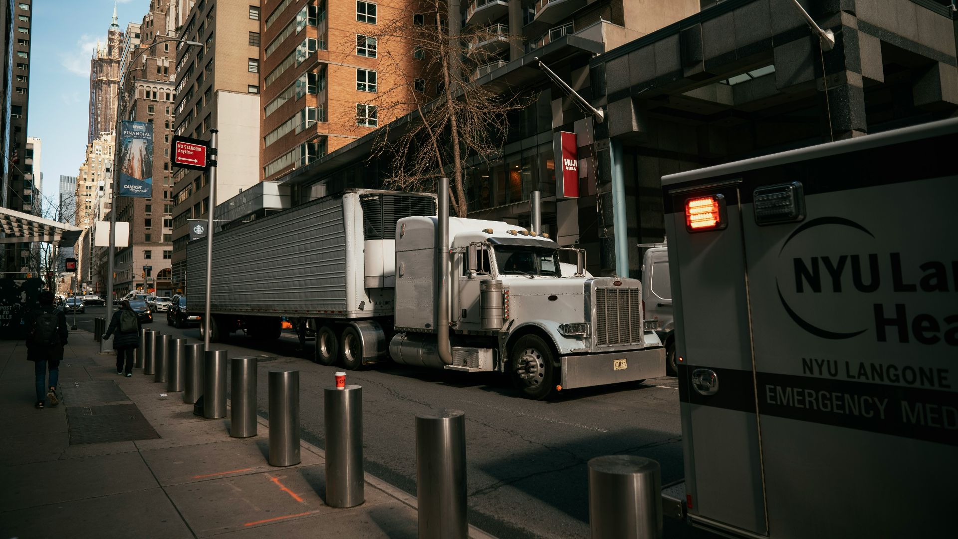 a large truck is parked on the side of the street