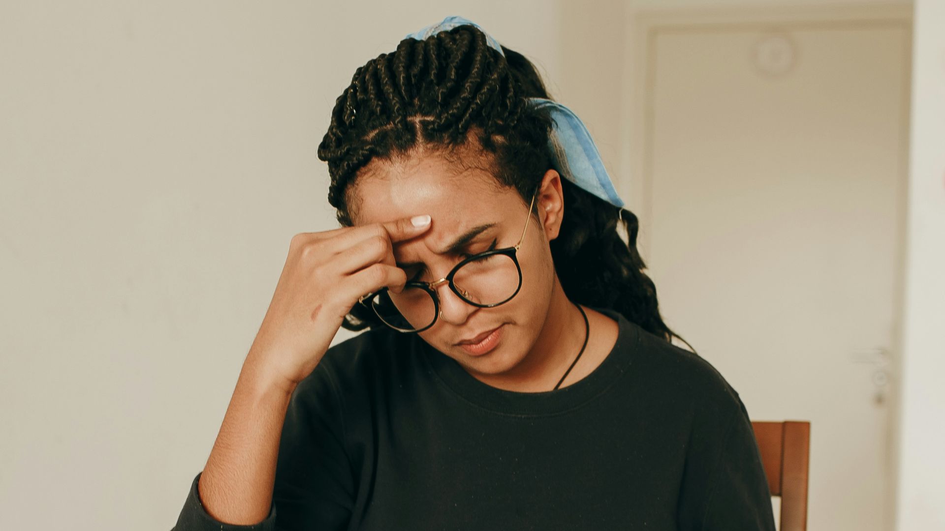 woman in black long sleeve shirt sitting on chair
