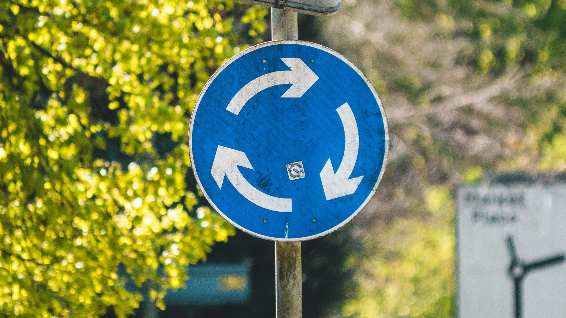 blue and white road sign