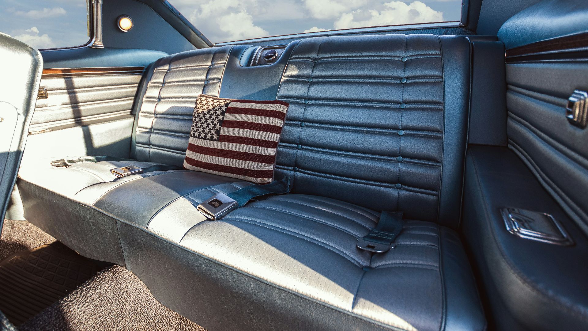The interior of a car with a flag on the seat