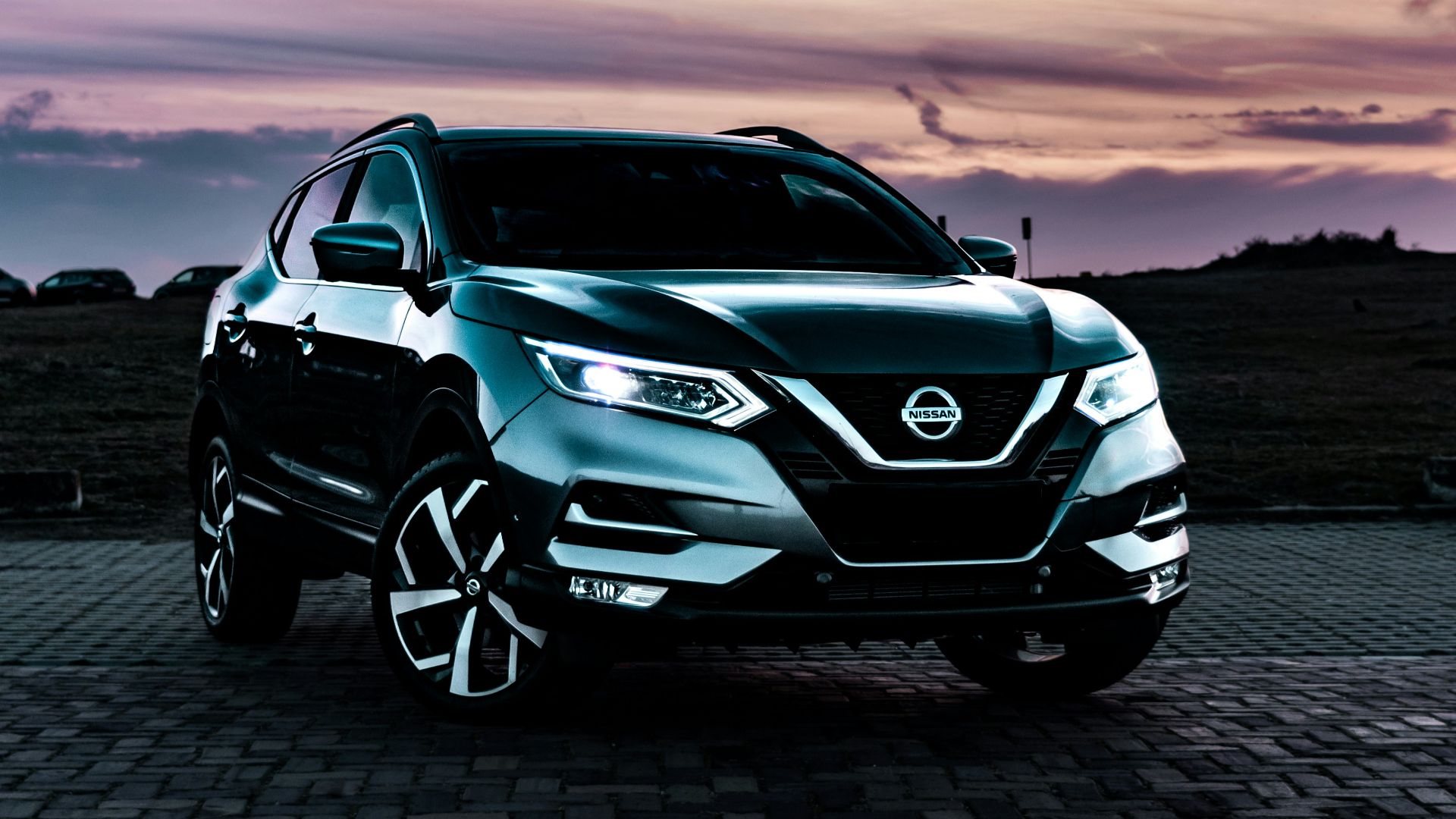gray Nissan Rogue SUV outdoor during nighttime