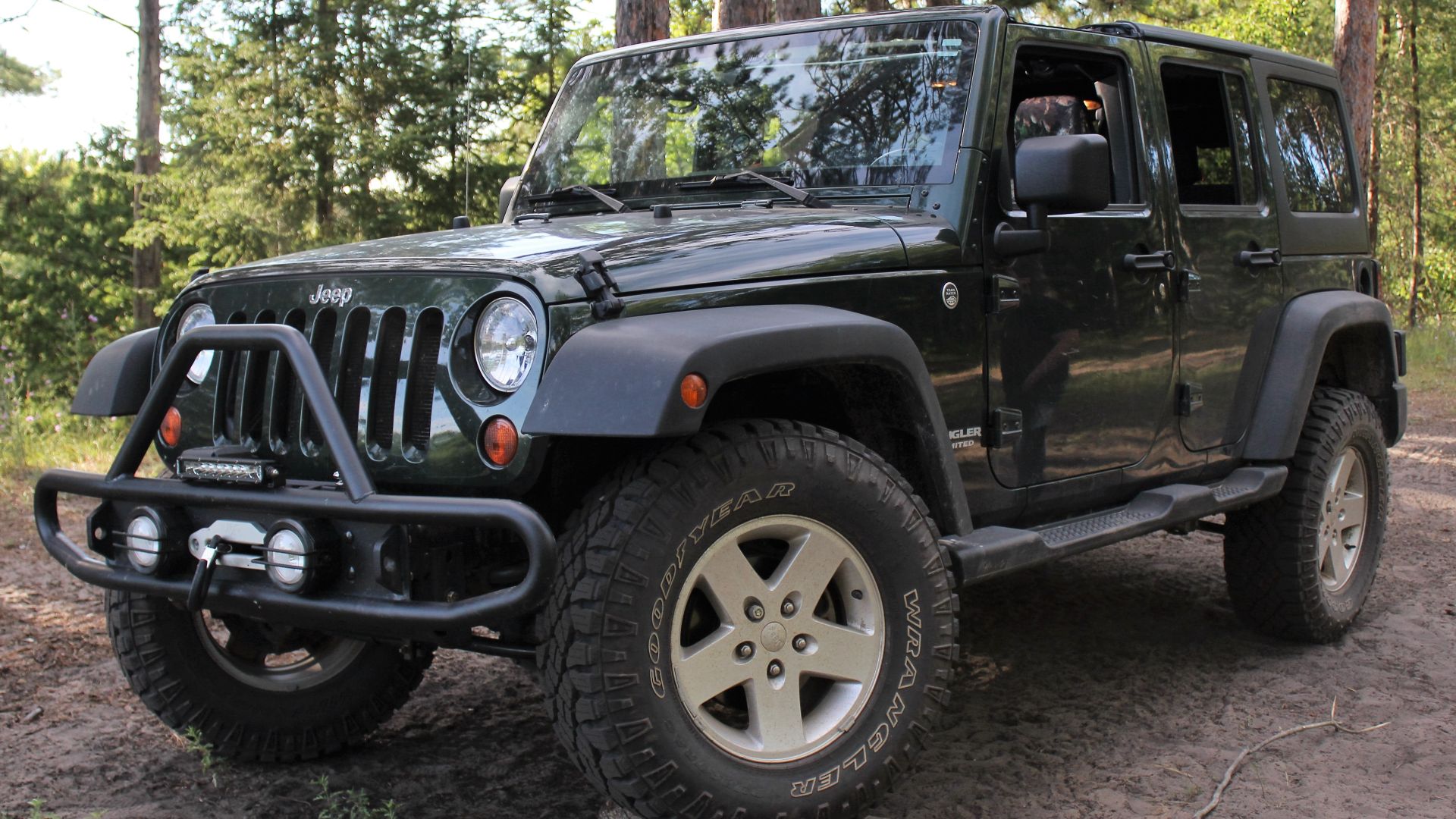 File:2011 jeep wrangler propped on wood stacks.jpg