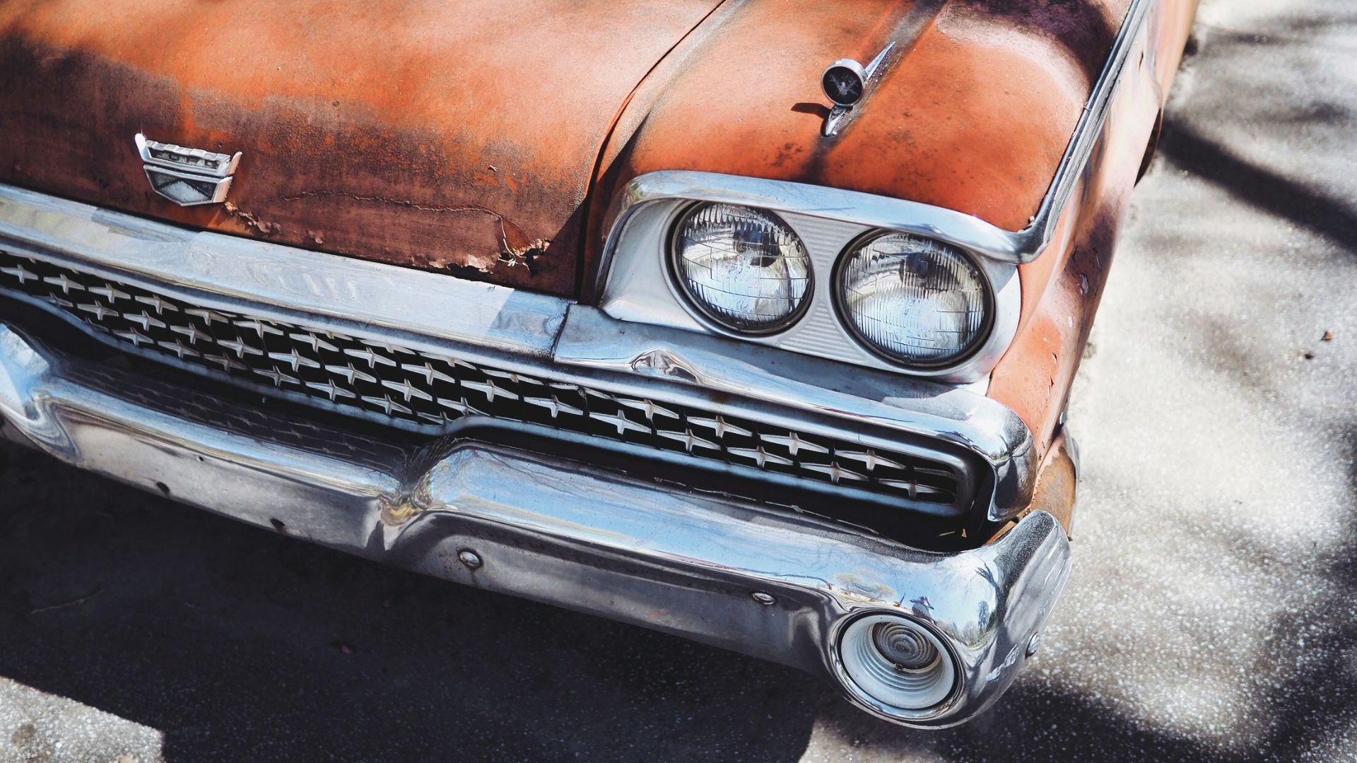 vintage orange car during daytime