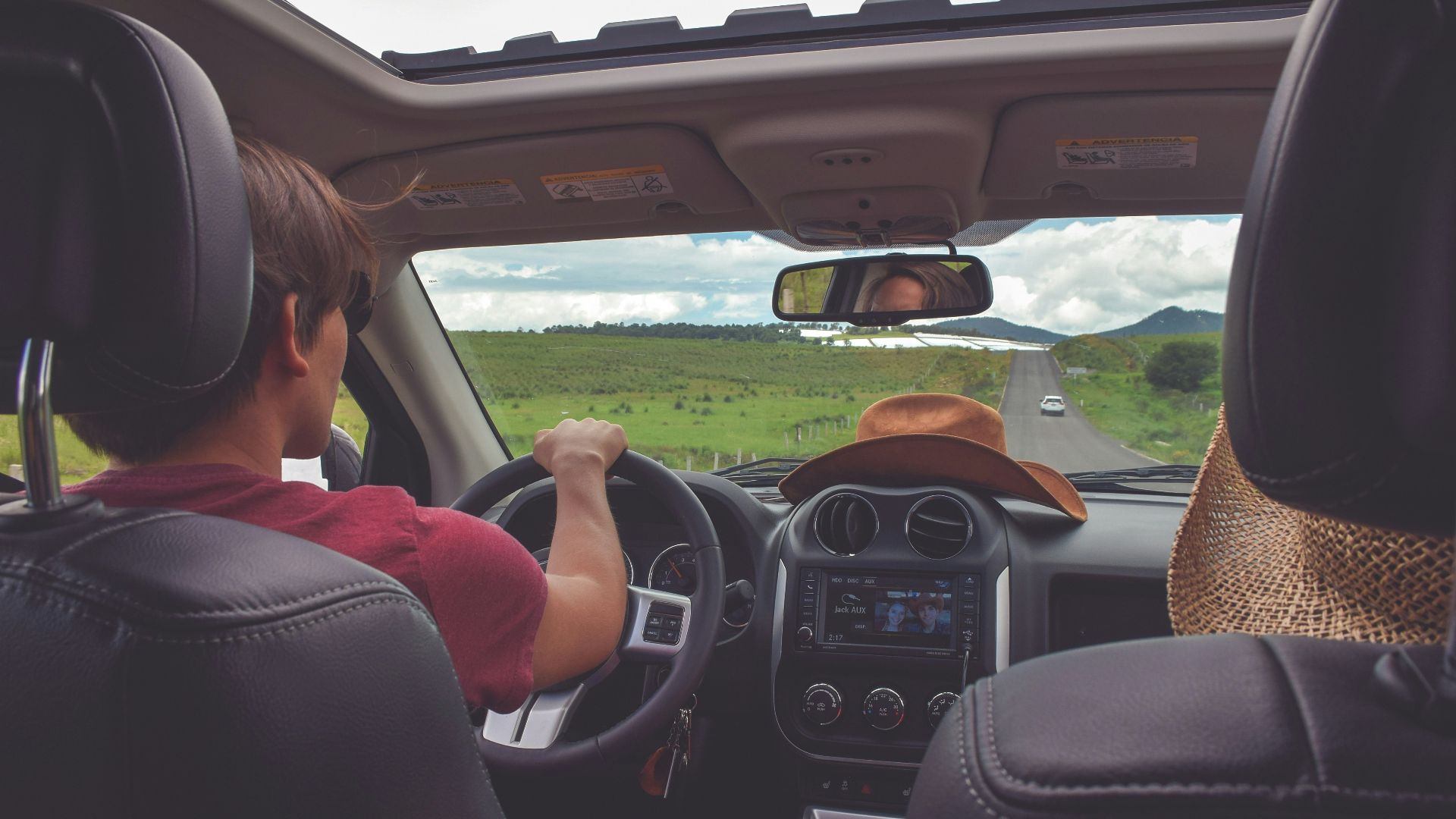 man driving straight on pathway during day time