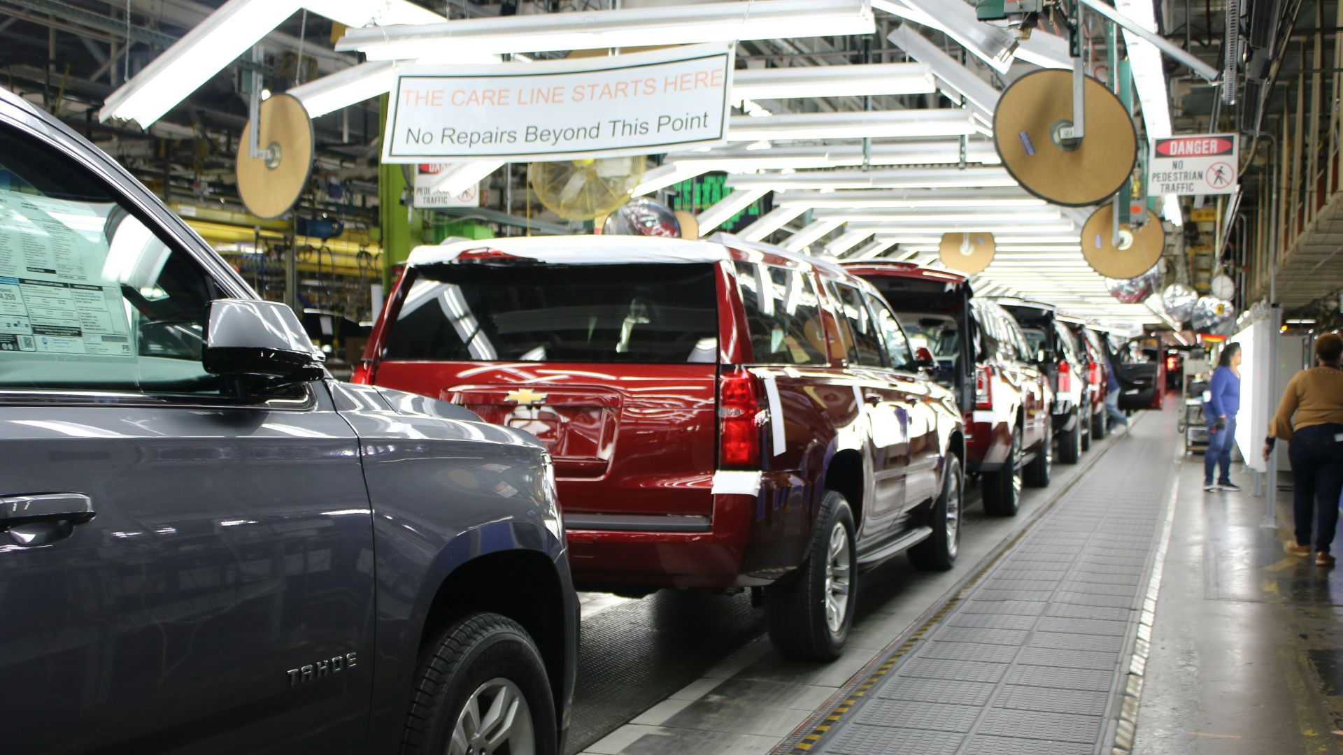 a row of cars parked in a parking lot