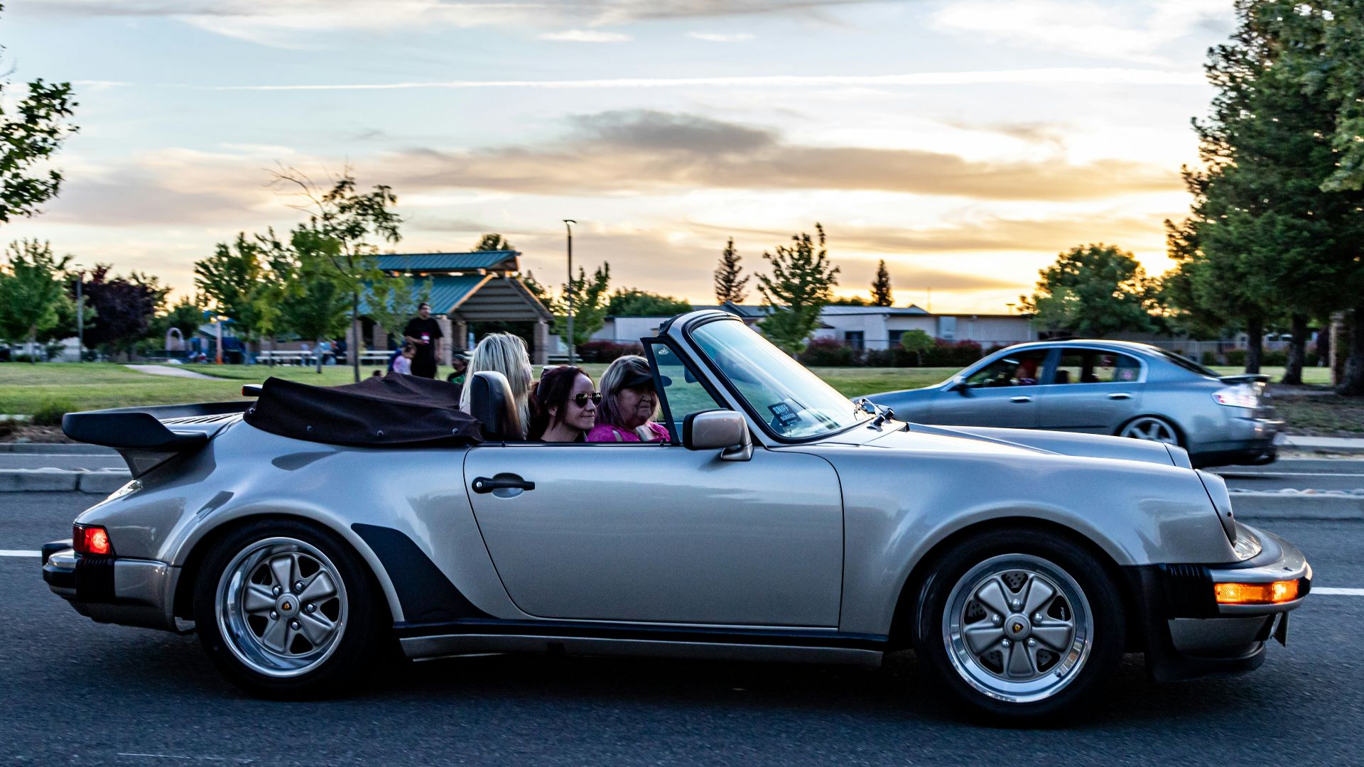 white convertible car on road during daytime
