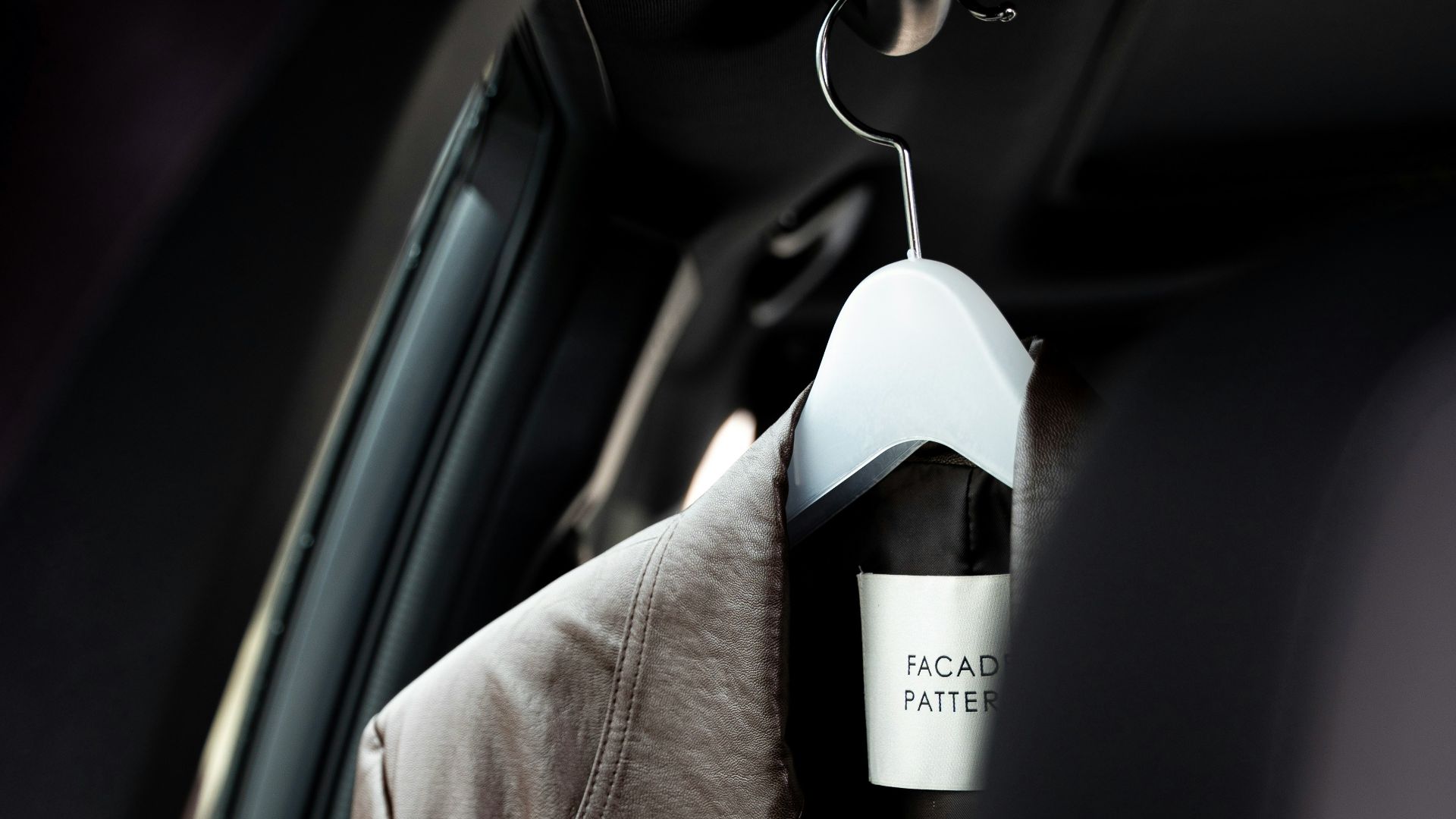 a coat hanging in the back of a car