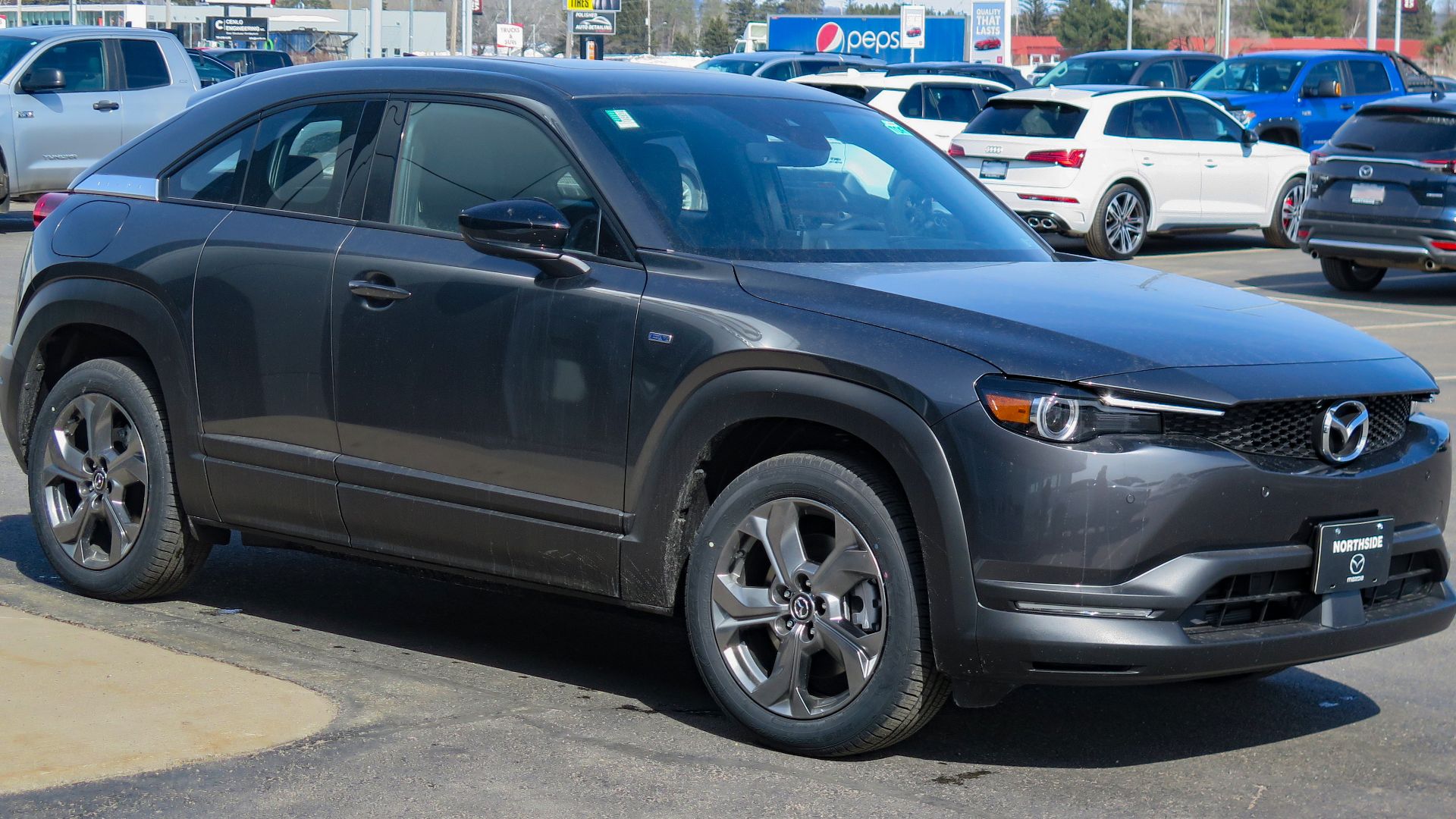 File:2023 Mazda MX-30 EV GT in Machine Grey Metallic, Front Right, 03-21-2023.jpg