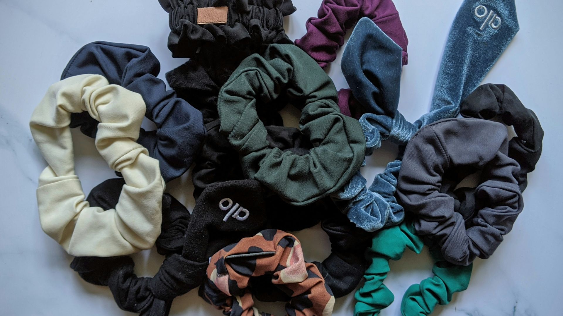 blue denim jeans with black and green ribbon