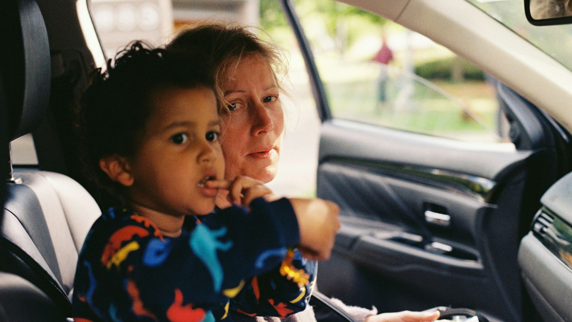 a person and a child in a car