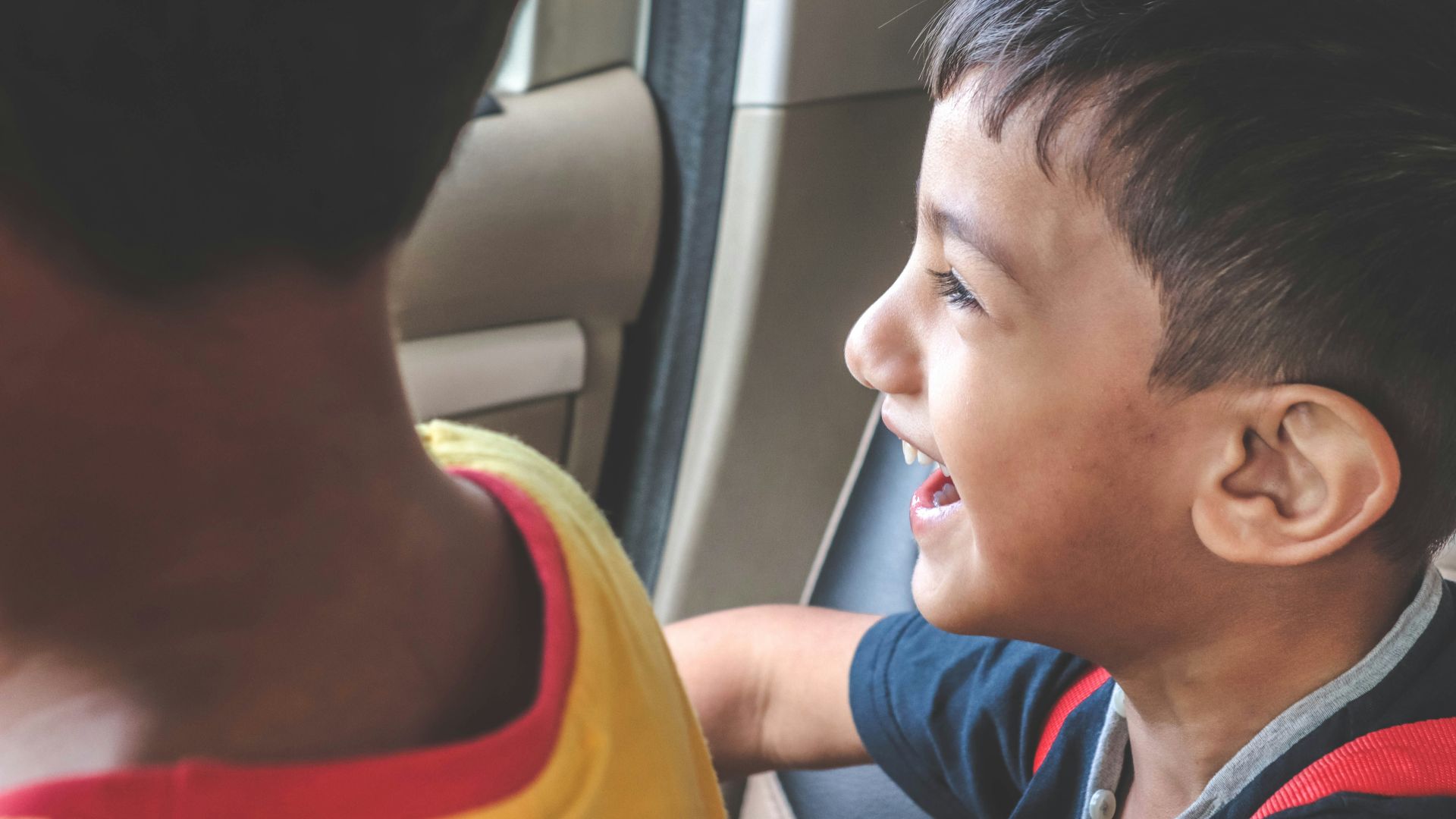 boy sitting inside vehicle