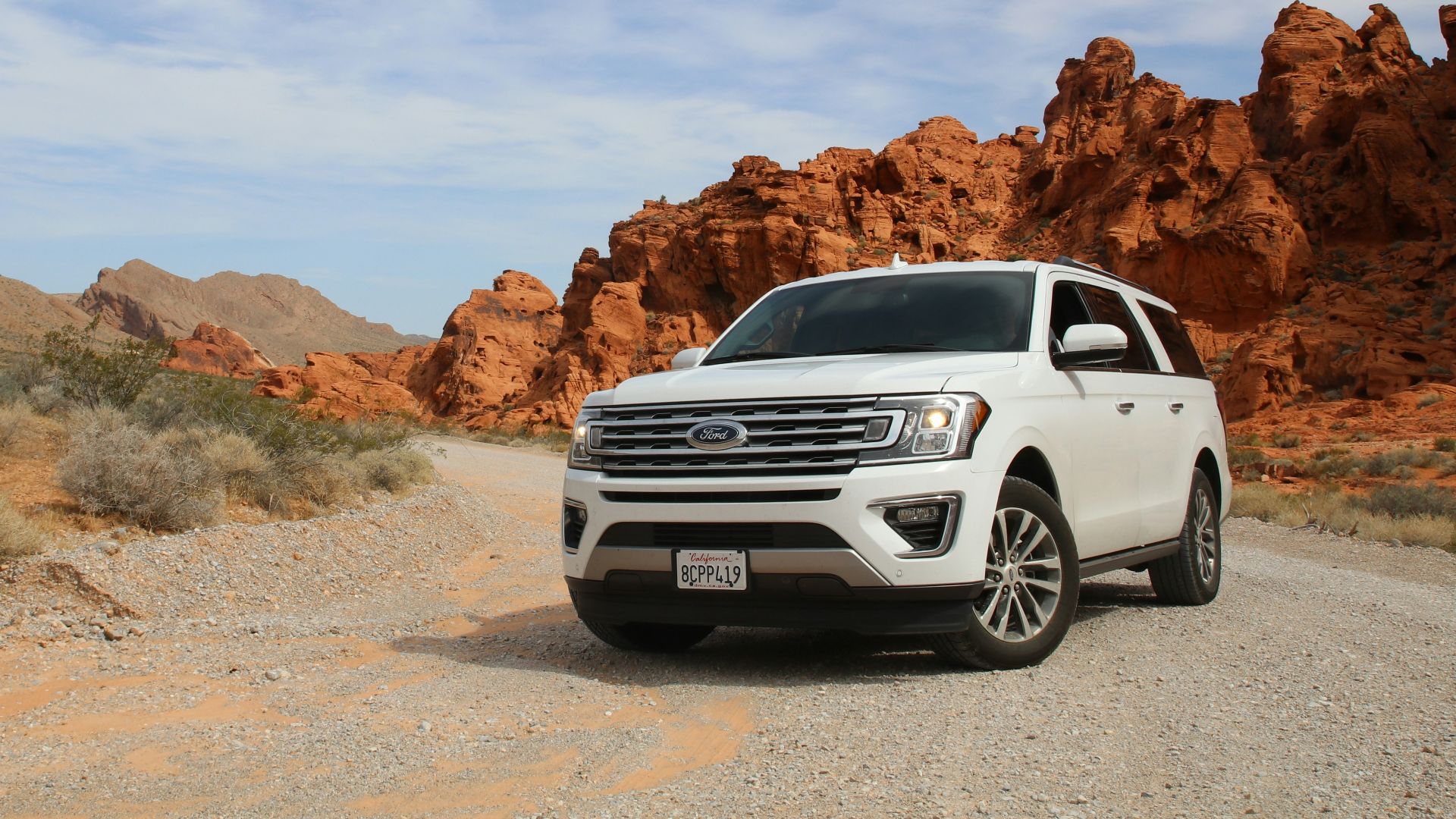 parked white Ford Explorer SUV