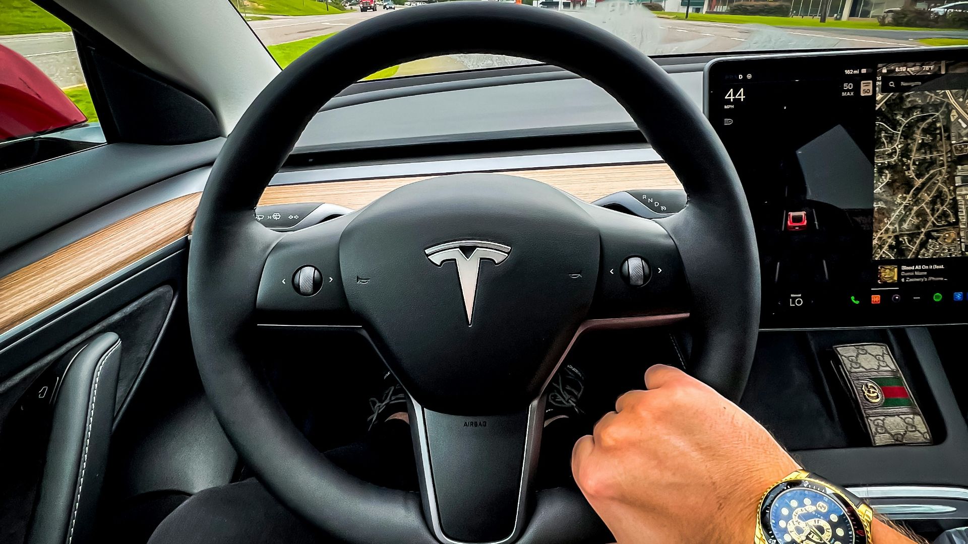 a man driving a car on a highway