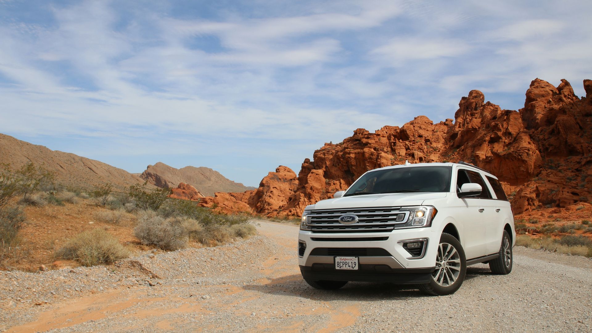 parked white Ford Explorer SUV