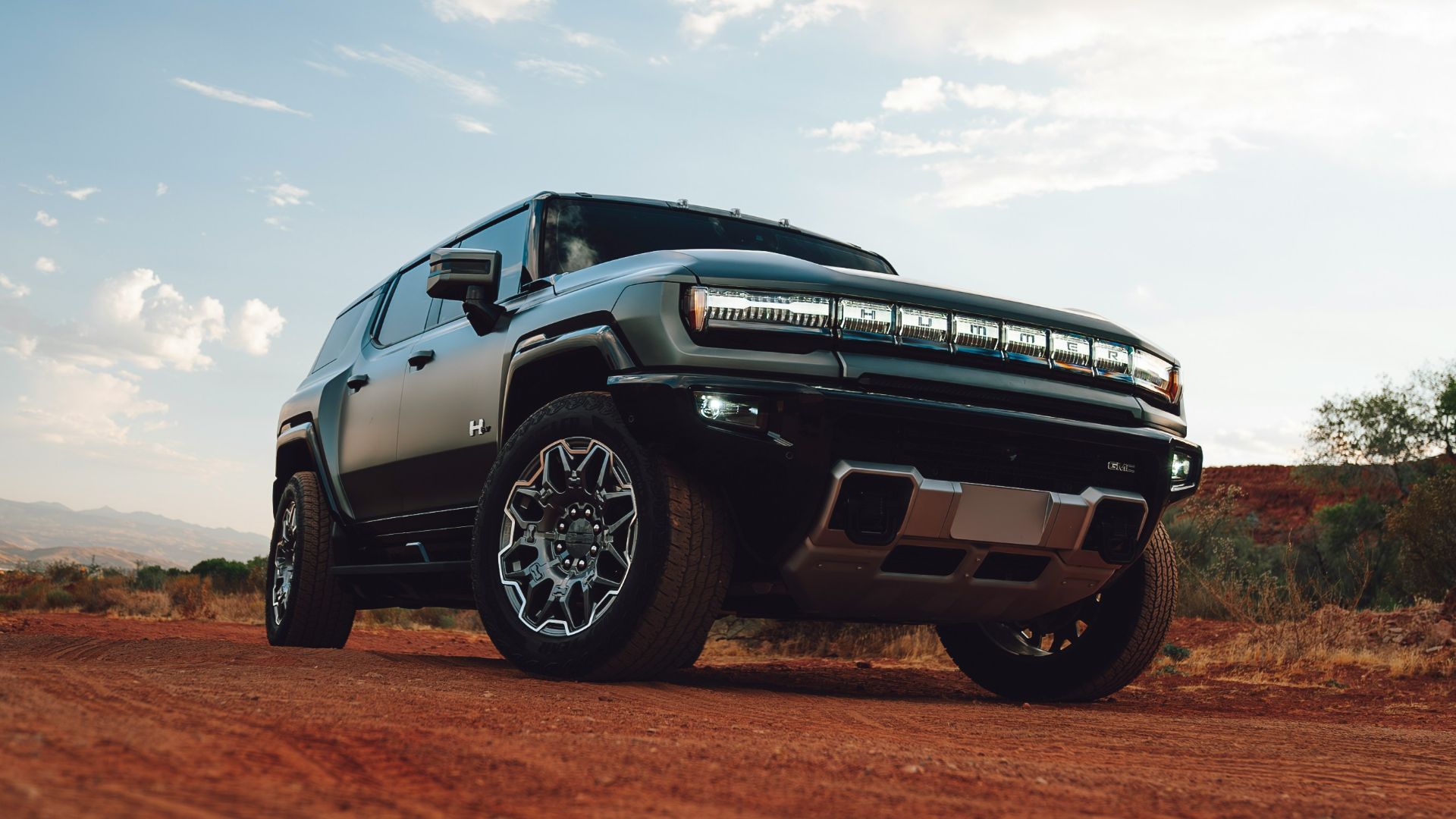 A truck is parked on a dirt road