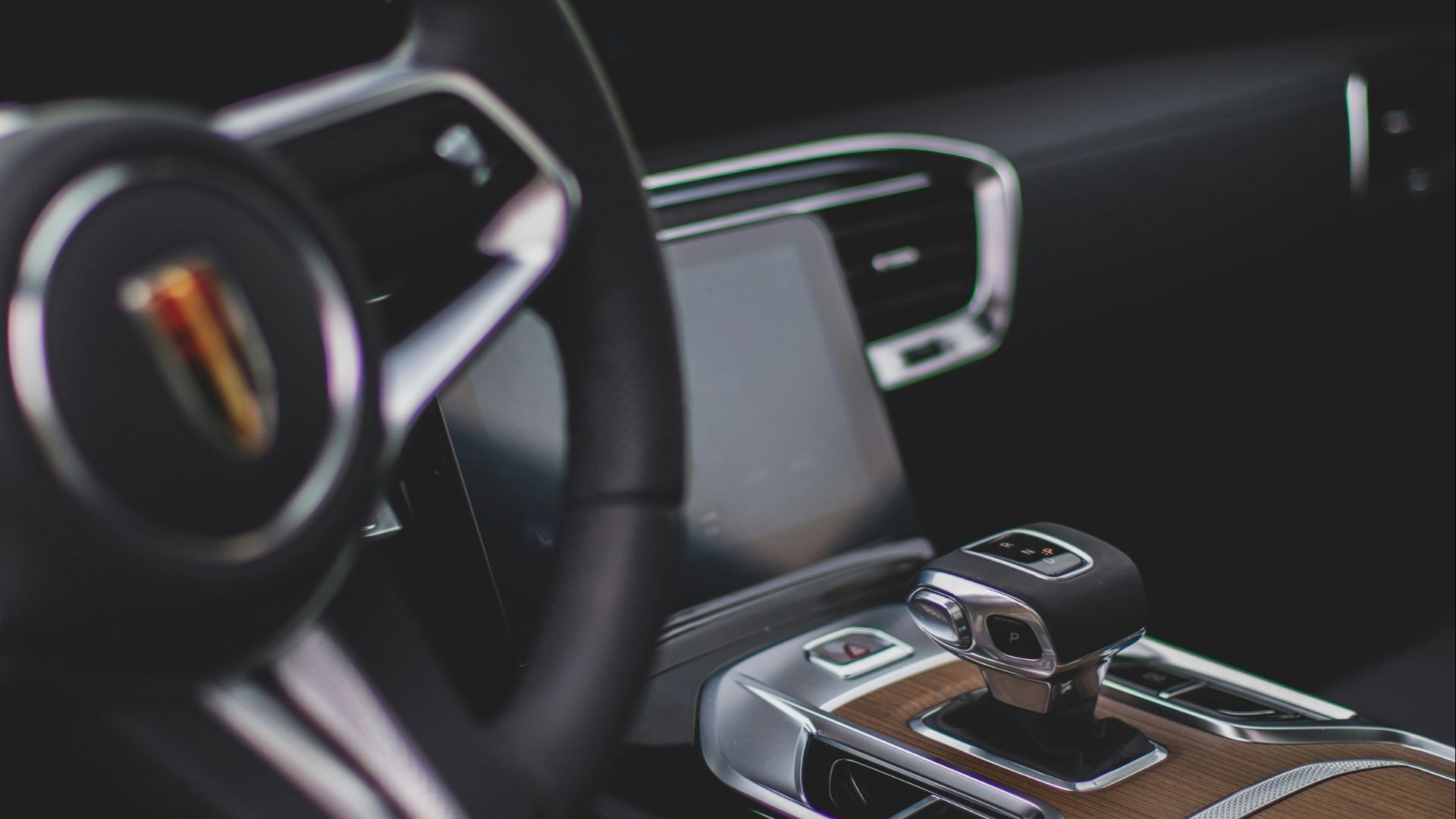 a steering wheel and dashboard of a car