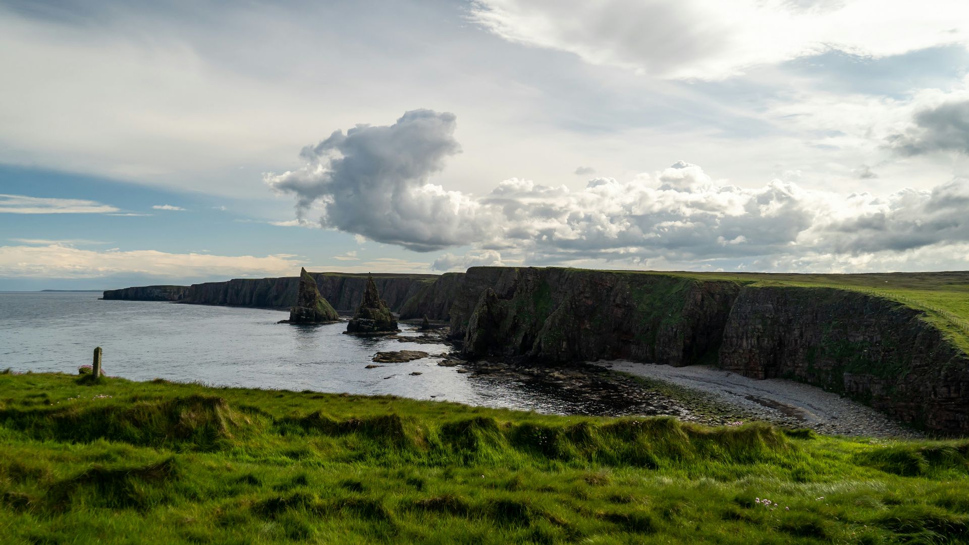 high-angle photography of beach under gray sky