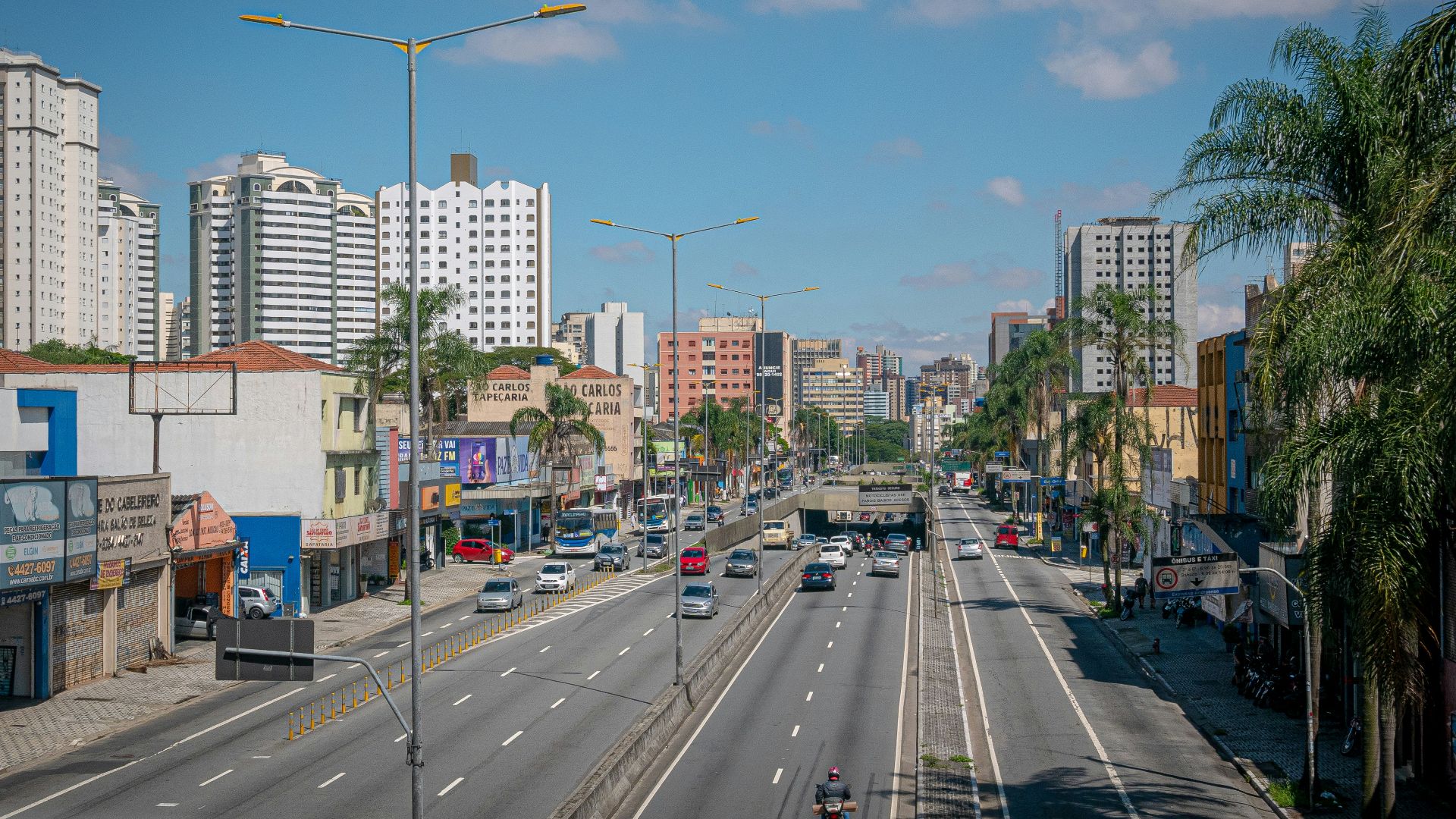 a city street with cars and buildings