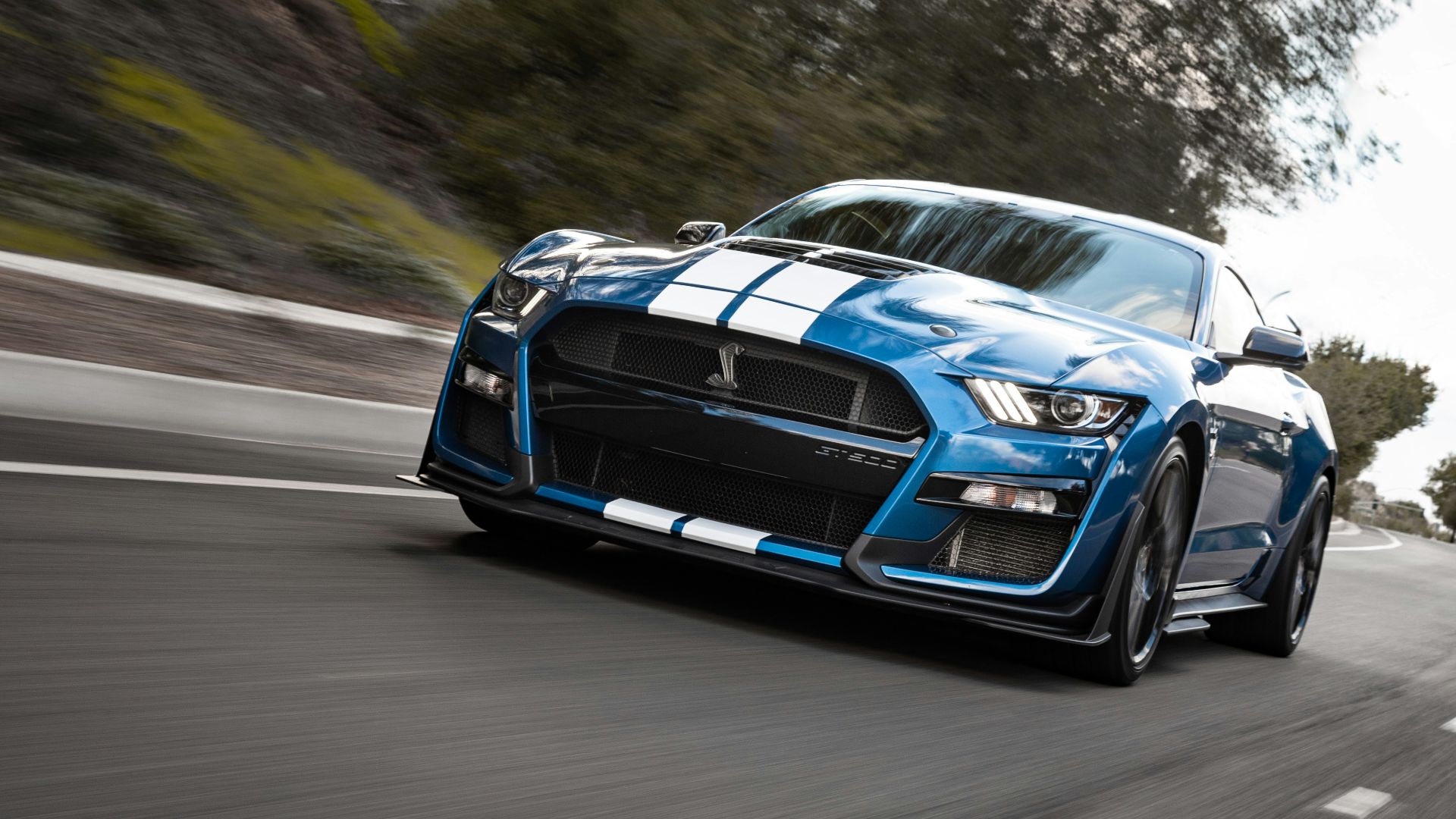 blue bmw m 3 on road during daytime