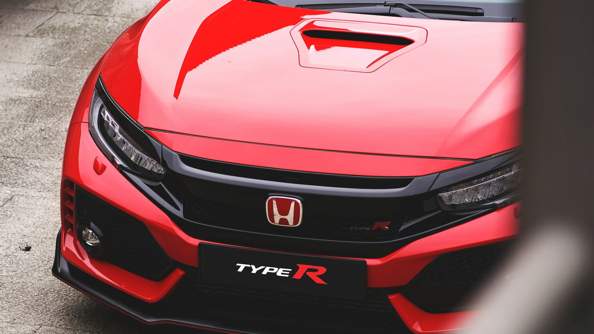 red Honda vehicle