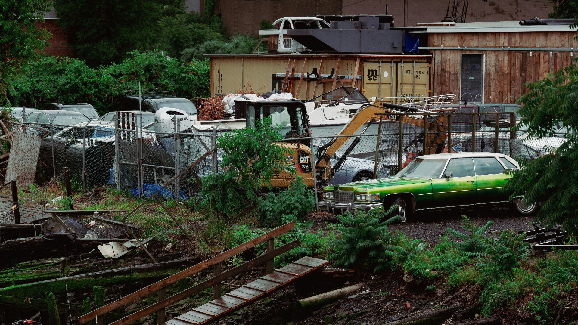 A bunch of cars that are sitting in the dirt