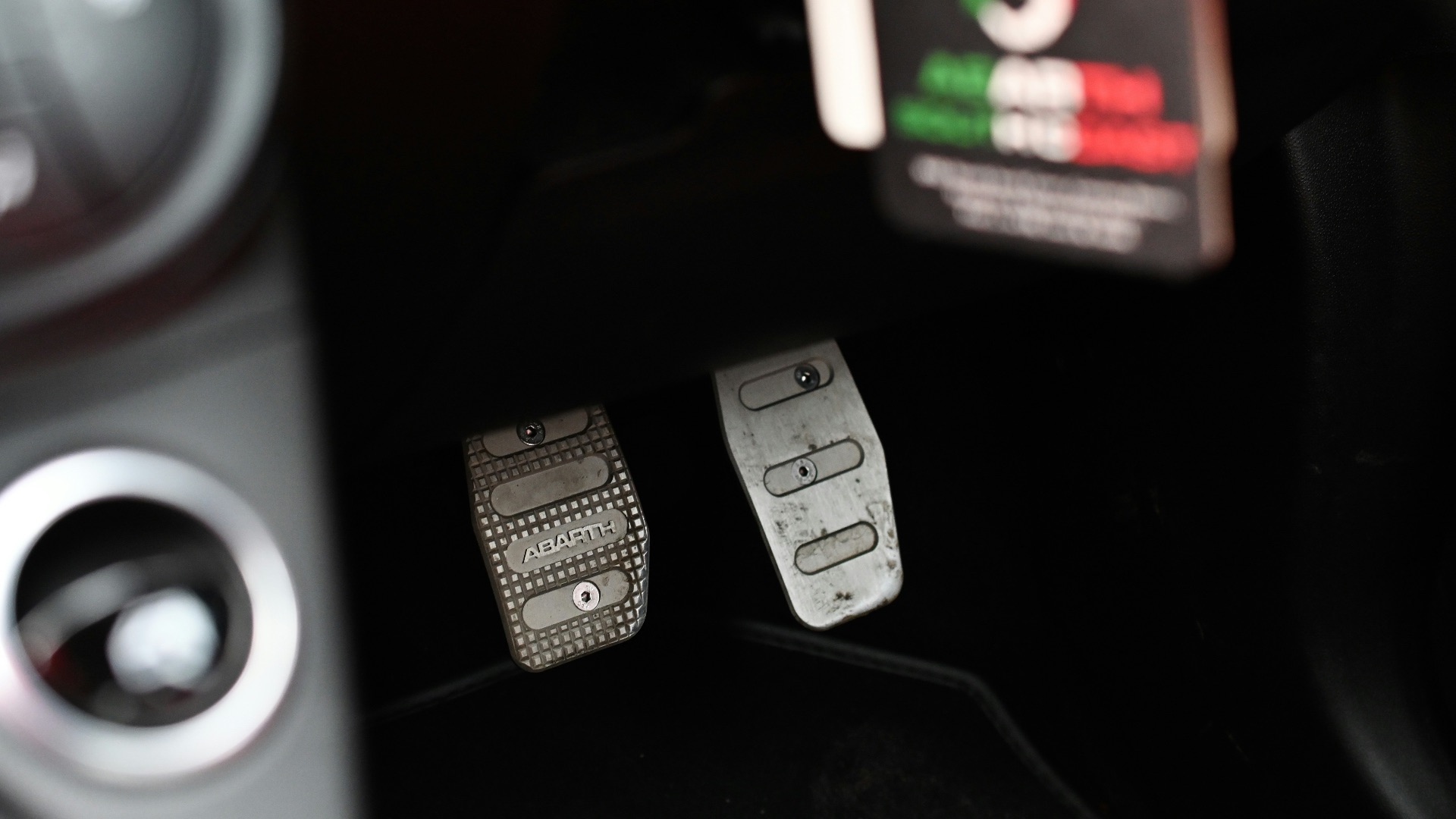 a close up of metal car pedals