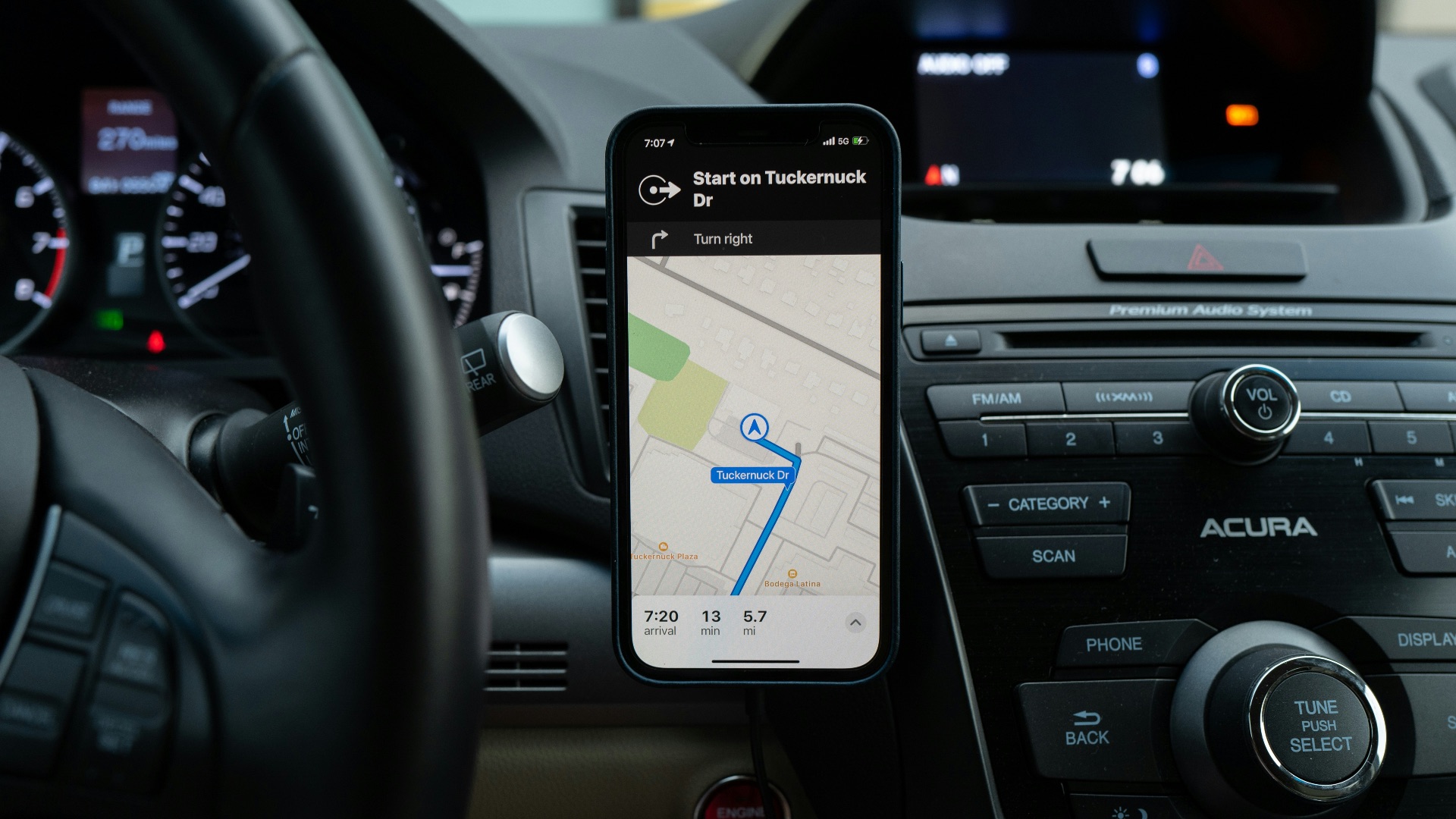 black android smartphone on car center console