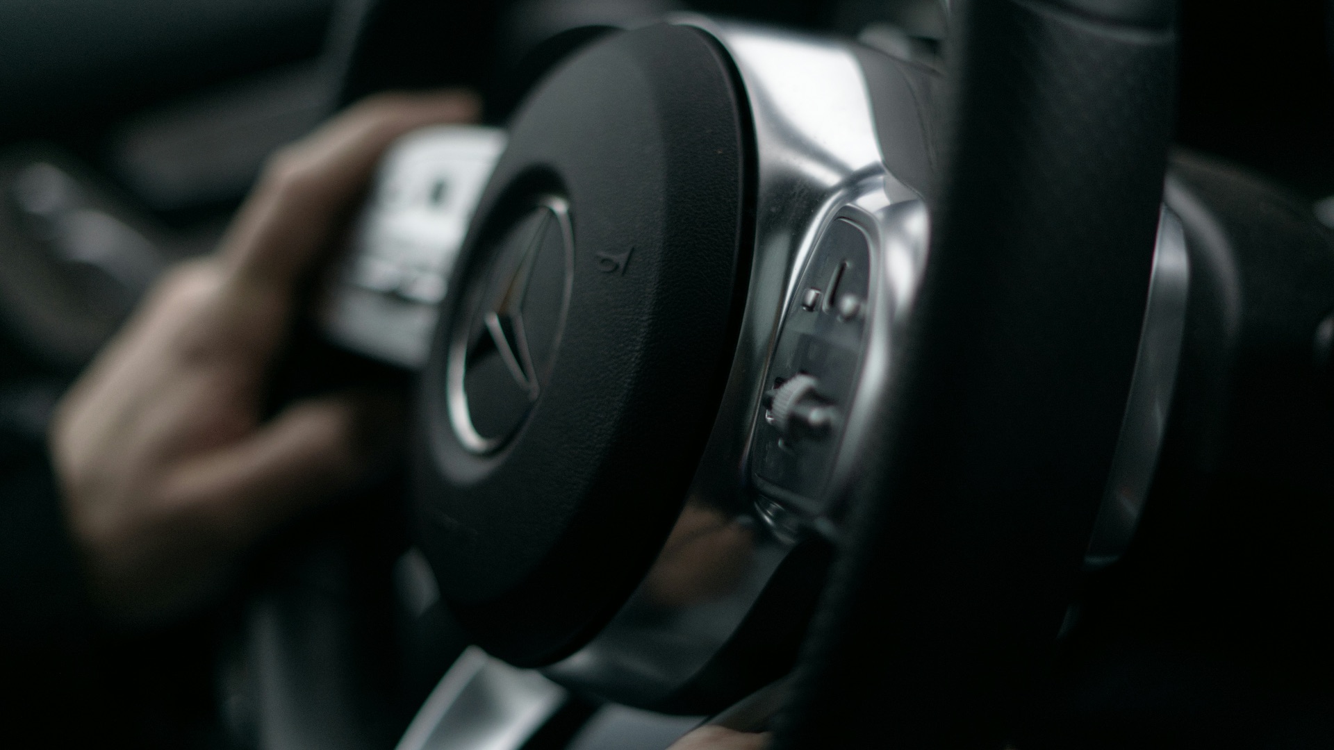 a close up of a person driving a car