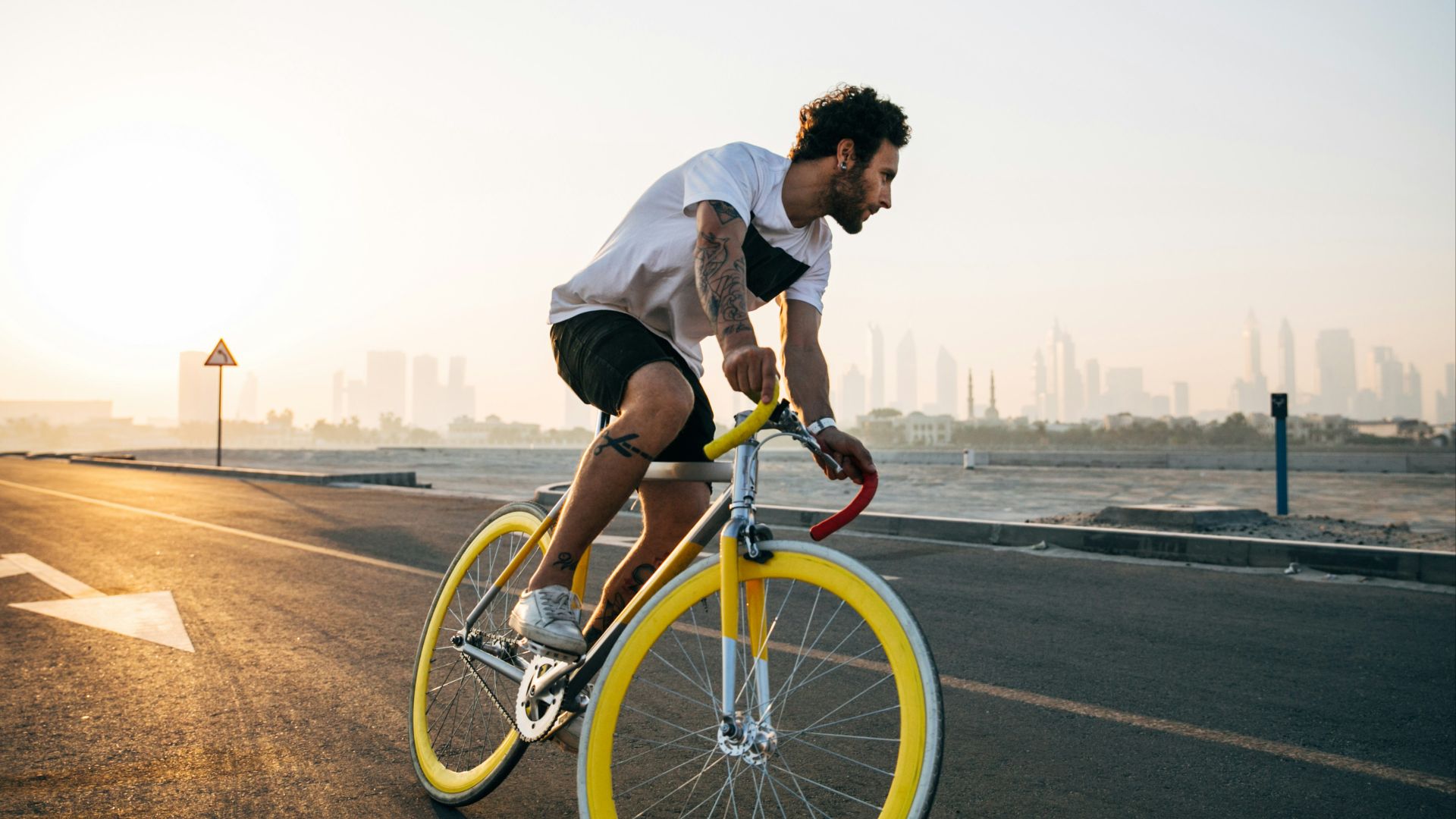 man riding bicycle on road during daytime