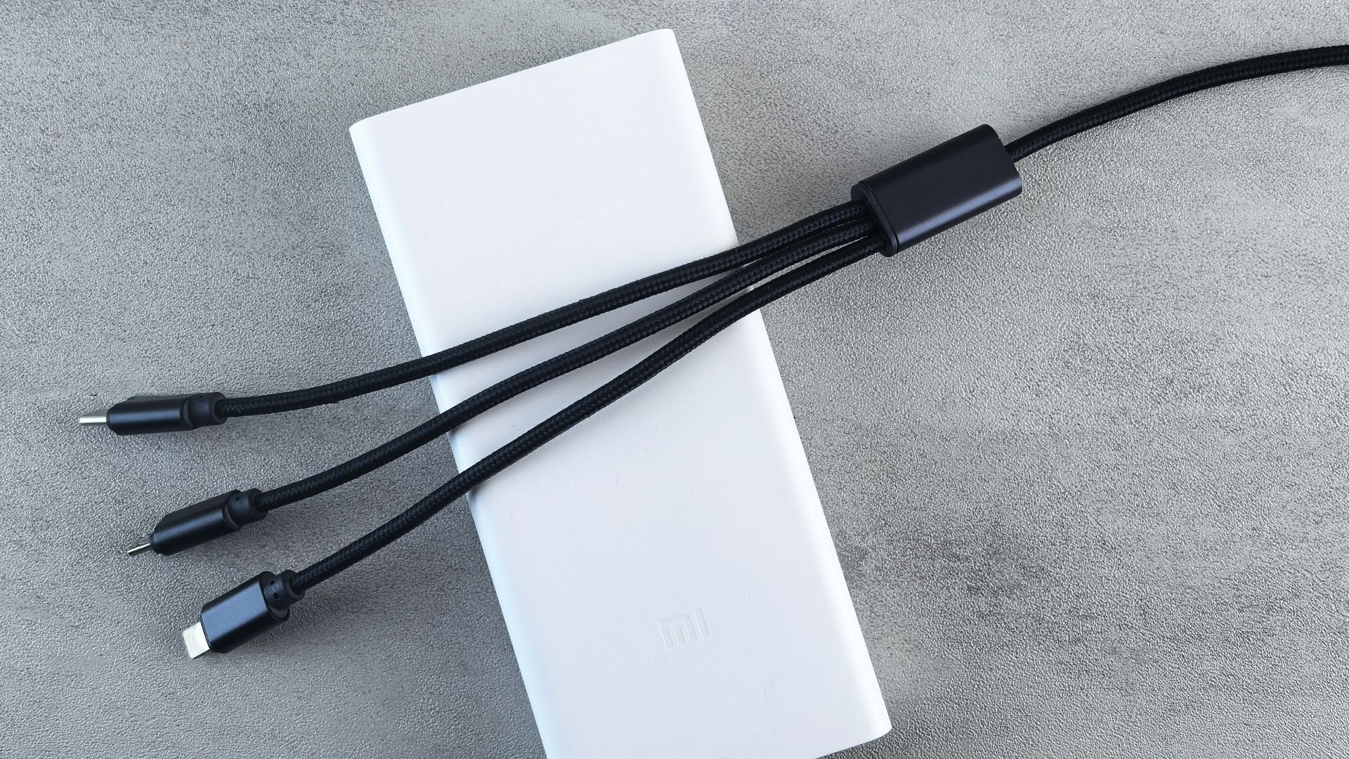 White power bank with three charging cables