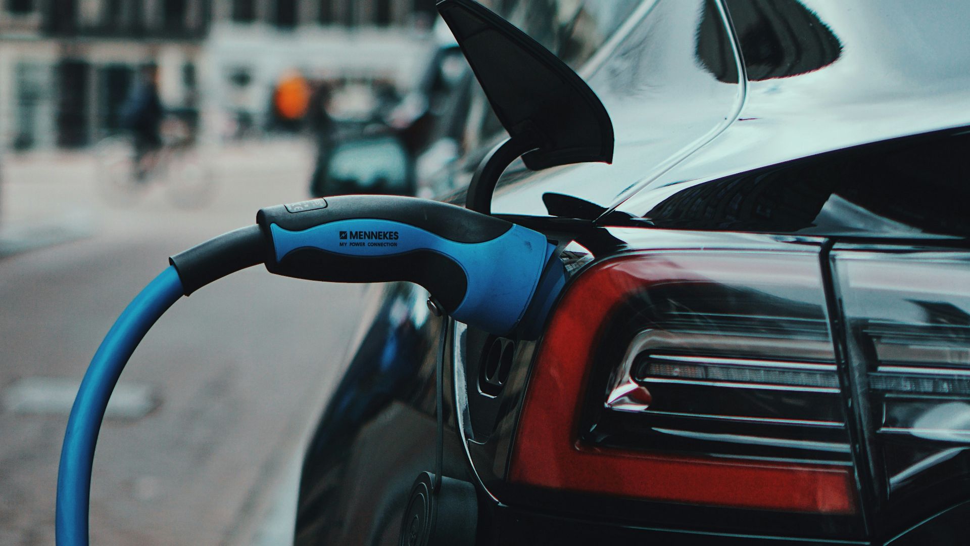 white and black car in front of white building during daytime