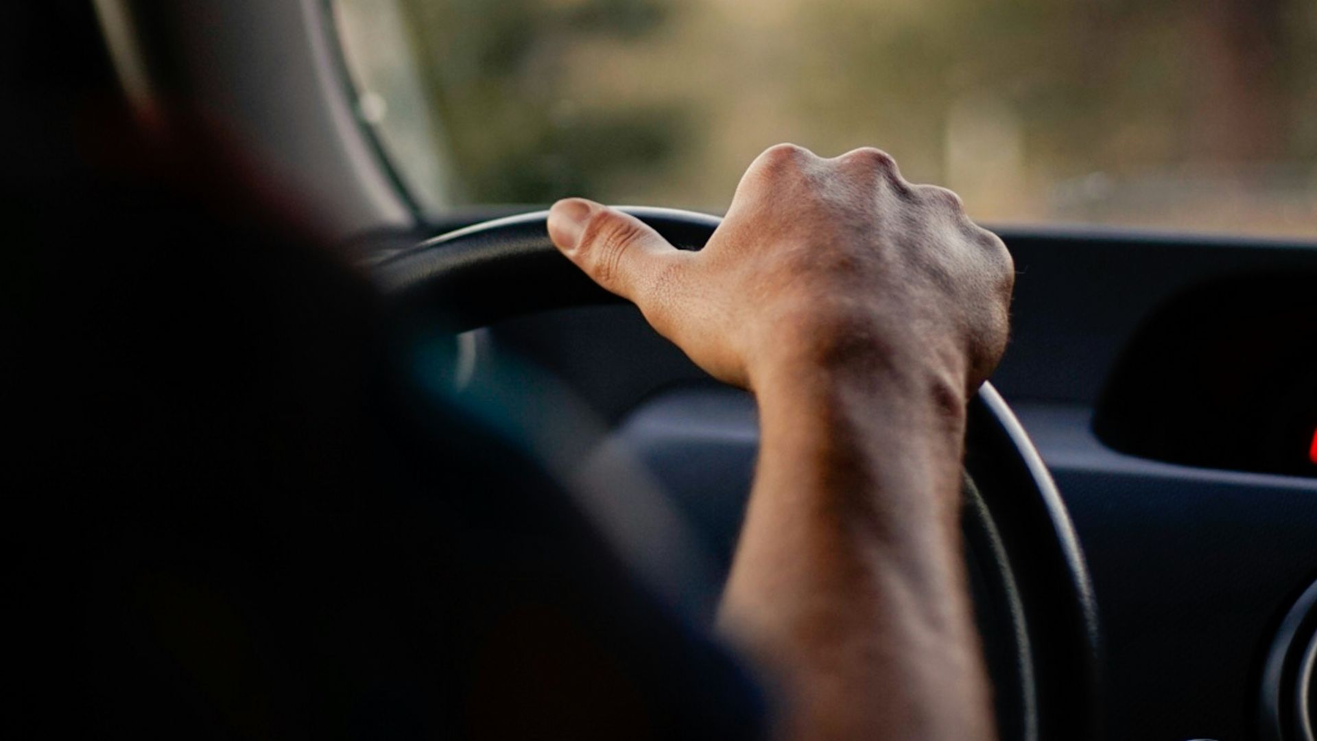 person driving car during daytime