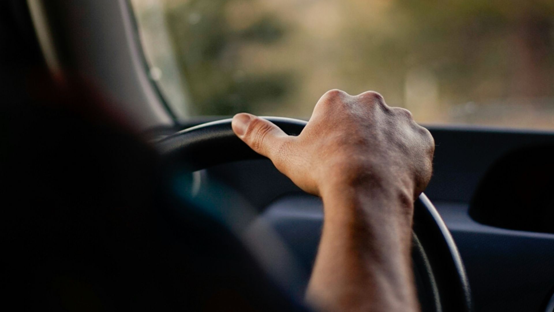 person driving car during daytime
