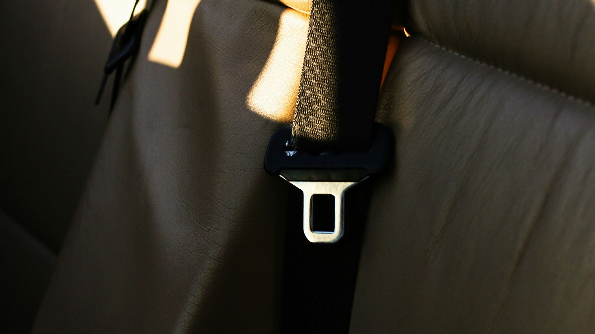 black and silver apple watch on black leather textile