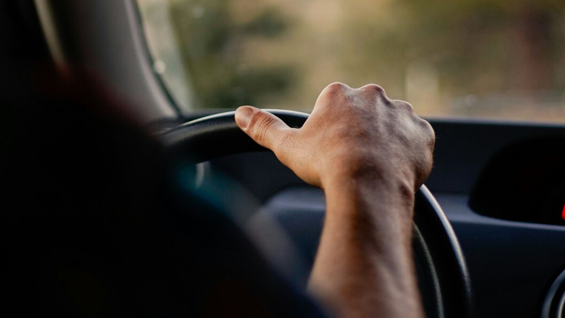 person driving car during daytime
