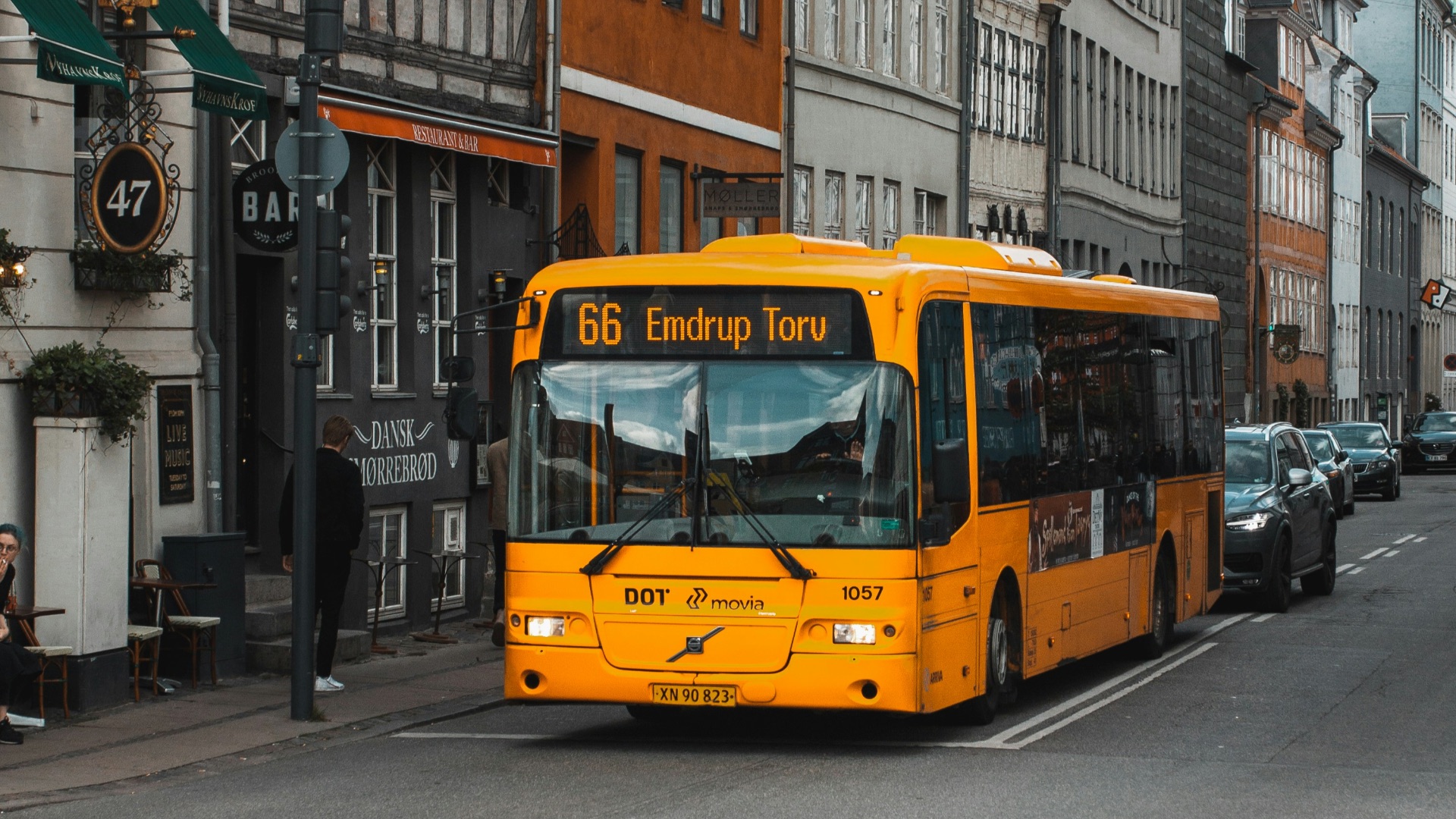 yellow and black bus on road at daytime