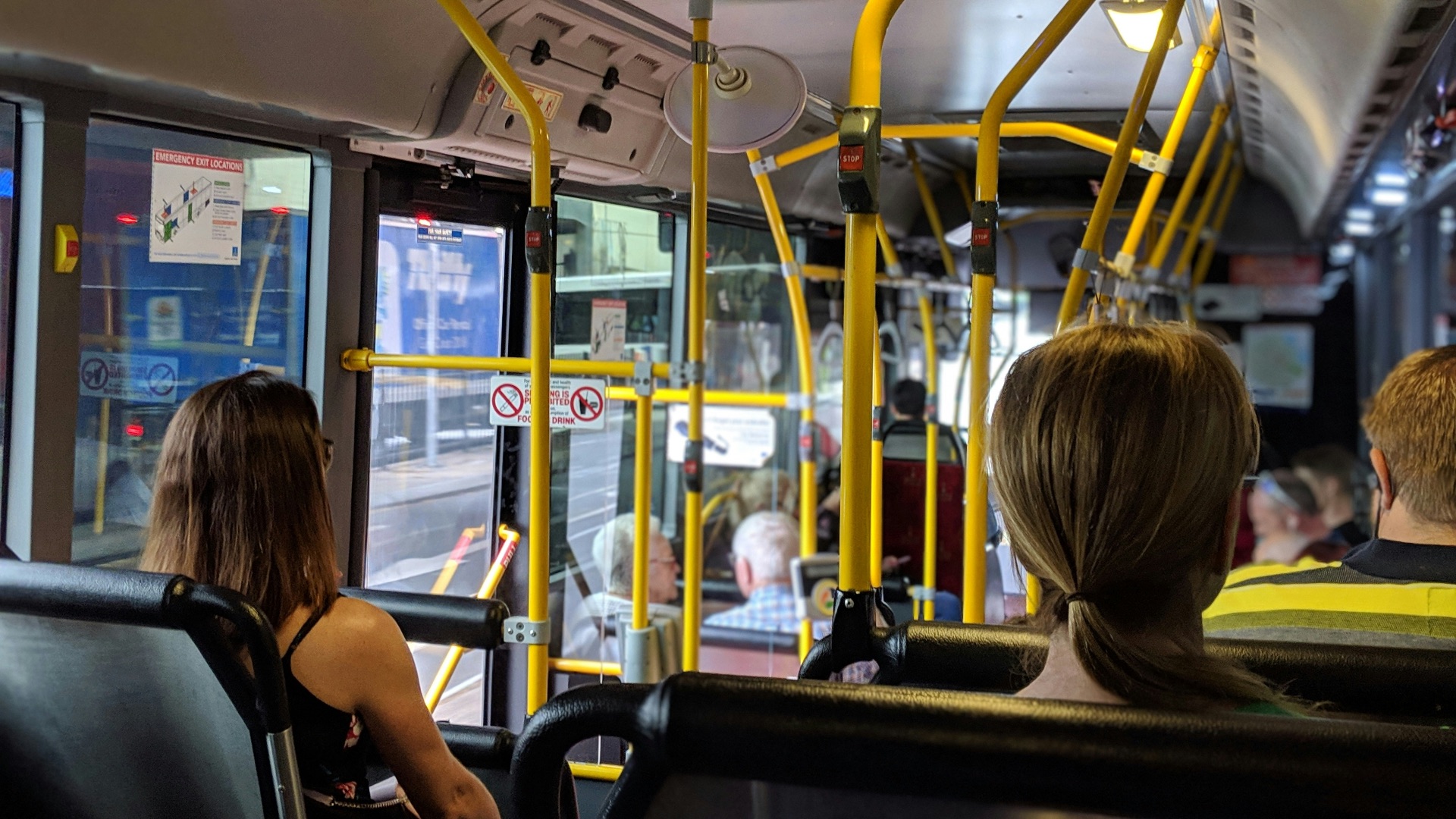 people sitting down inside vehicle