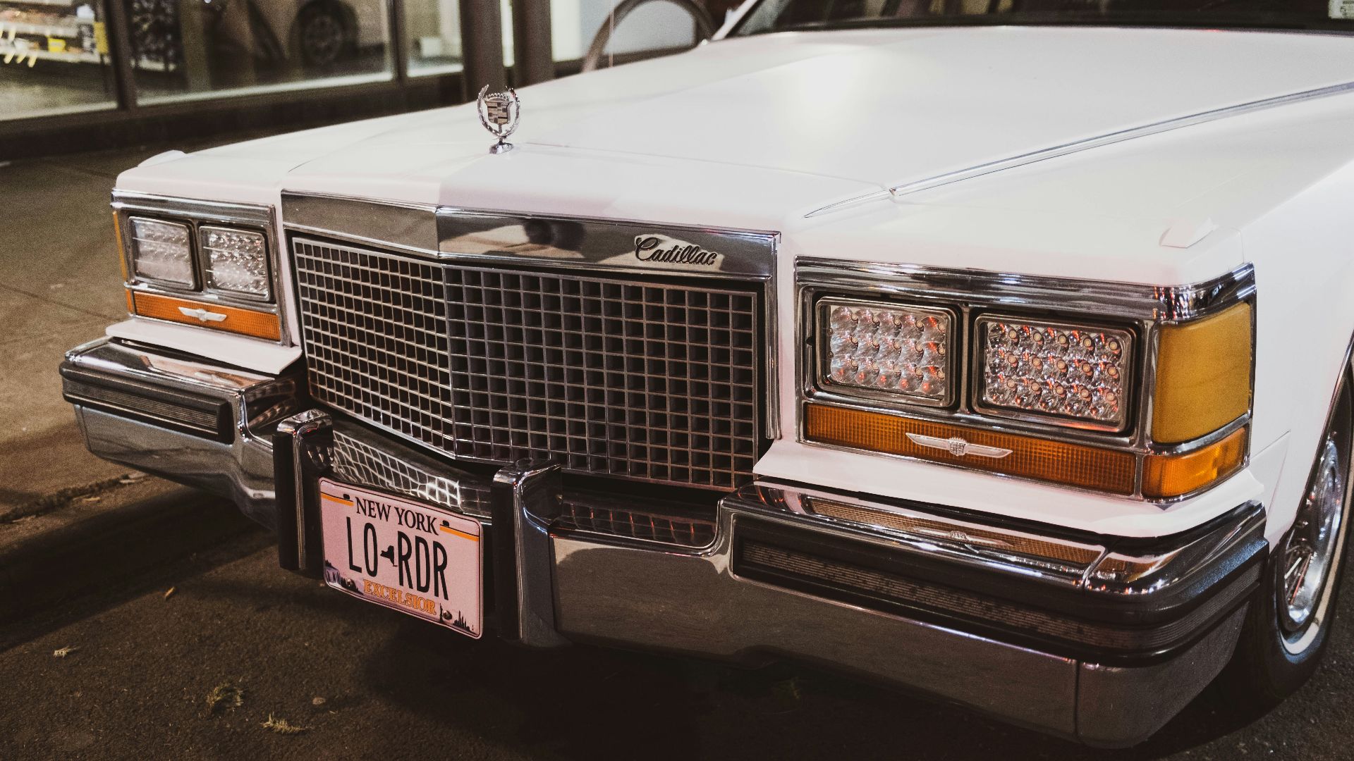 a white car parked on the side of the road