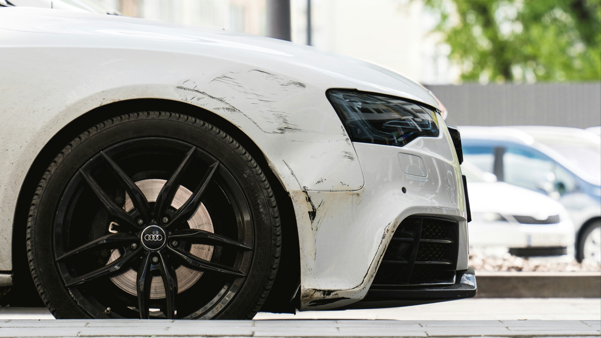 a white car parked on the side of the road