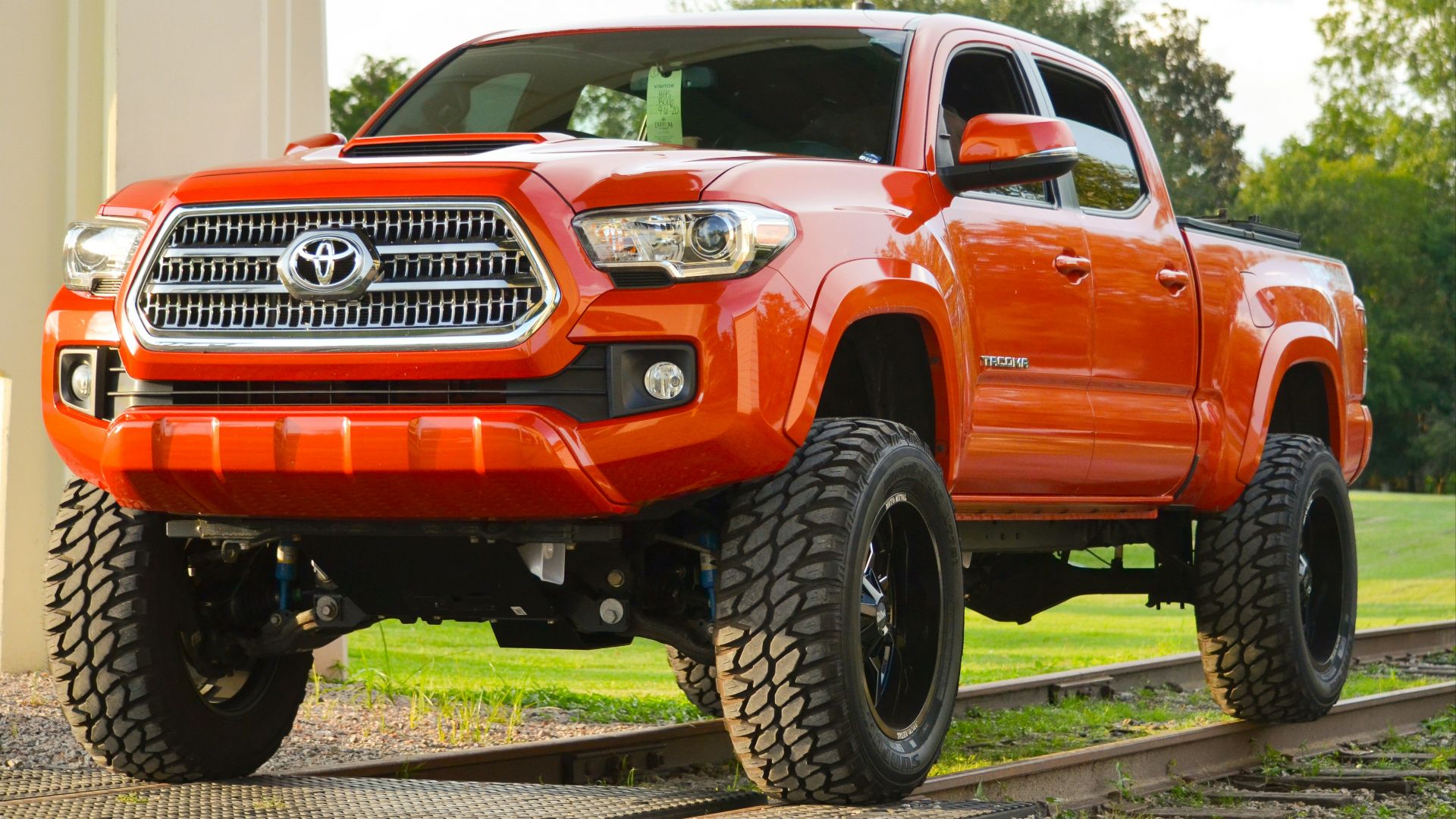 red chevrolet crew cab pickup truck